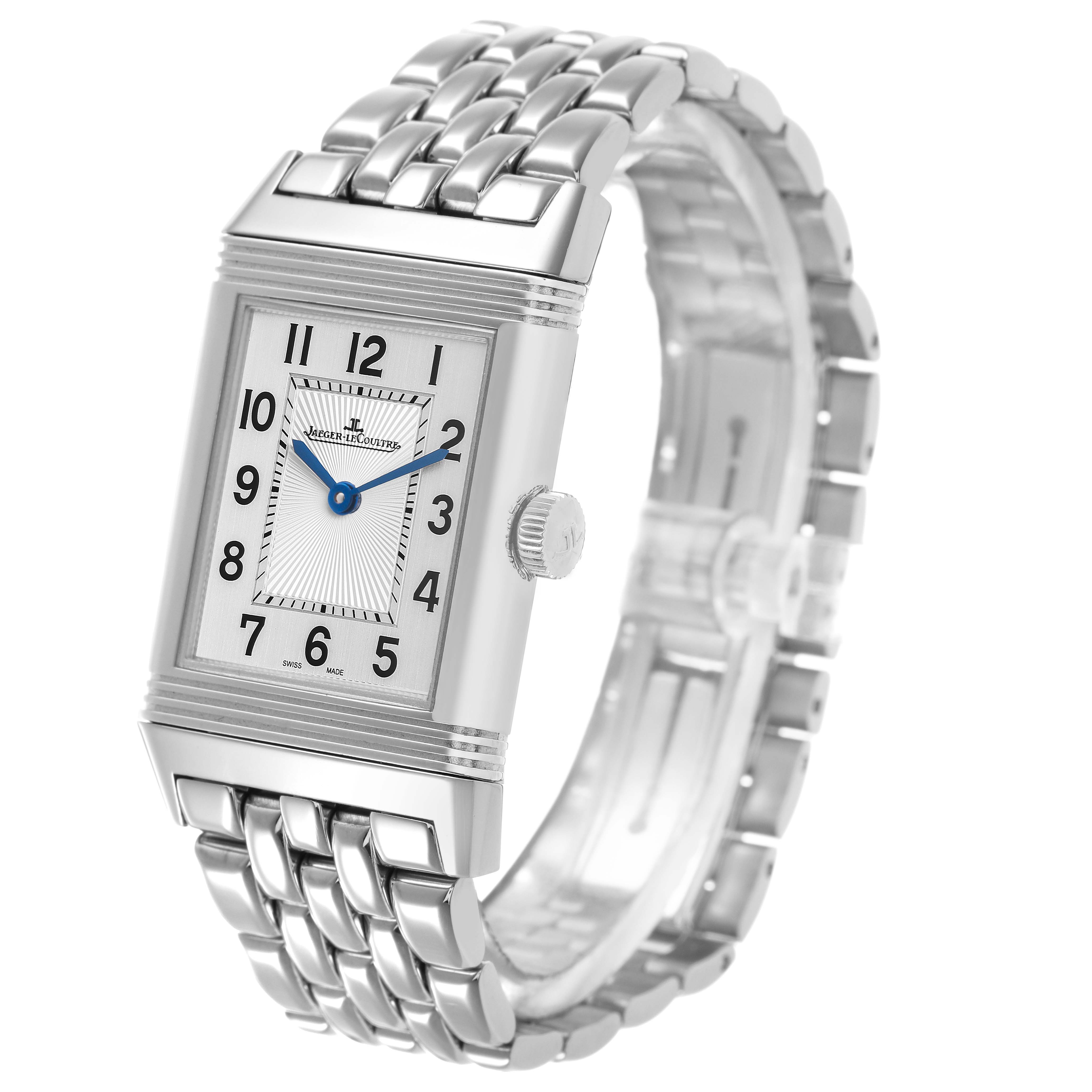 The Jaeger-LeCoultre Reverso watch is shown at an angle highlighting the rectangular face, crown, and metal bracelet.