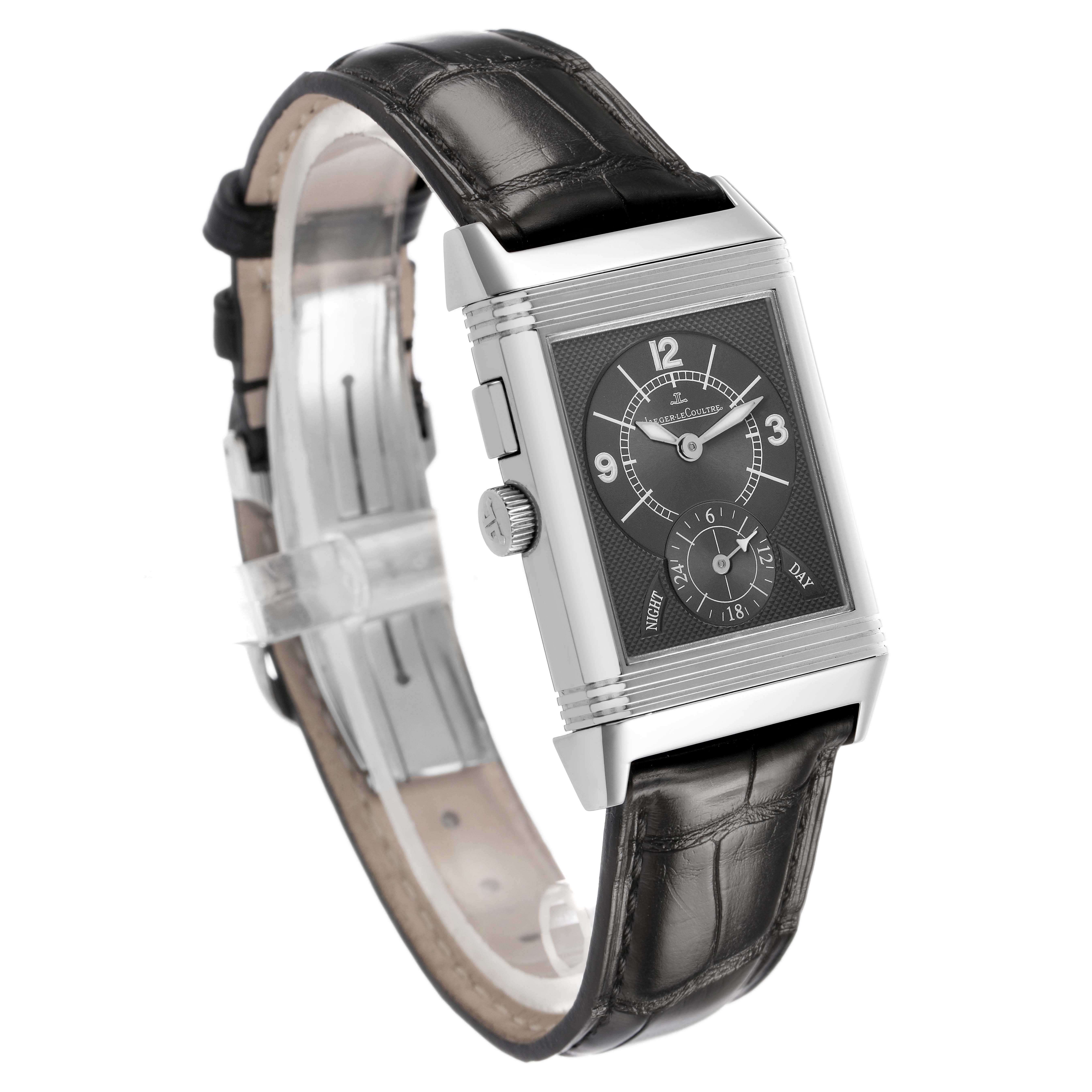 The Jaeger-LeCoultre Reverso watch is shown at a slight angle, displaying its face and black leather strap.