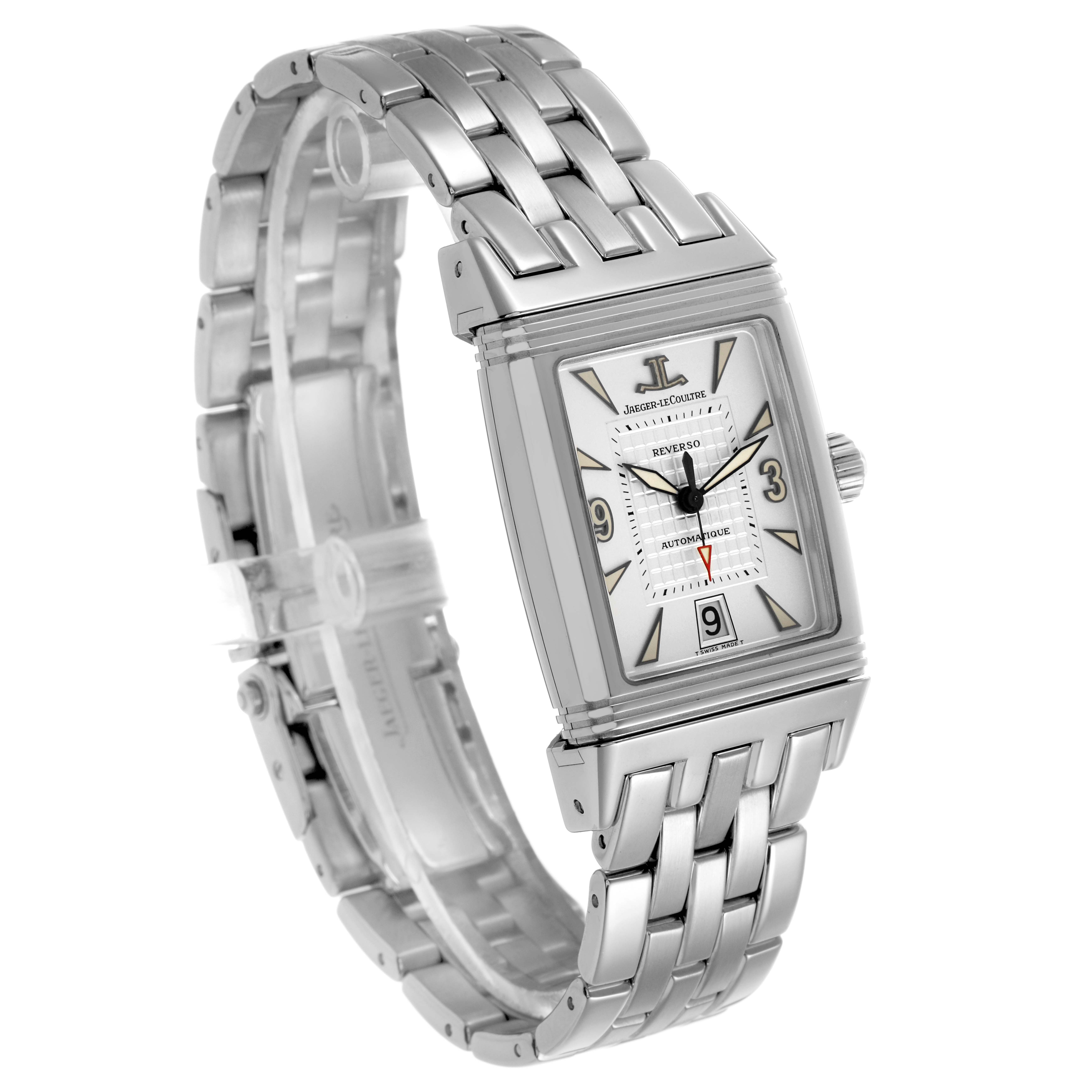 The Jaeger-LeCoultre Reverso watch is shown at a three-quarter angle, highlighting its rectangular case and metal bracelet.