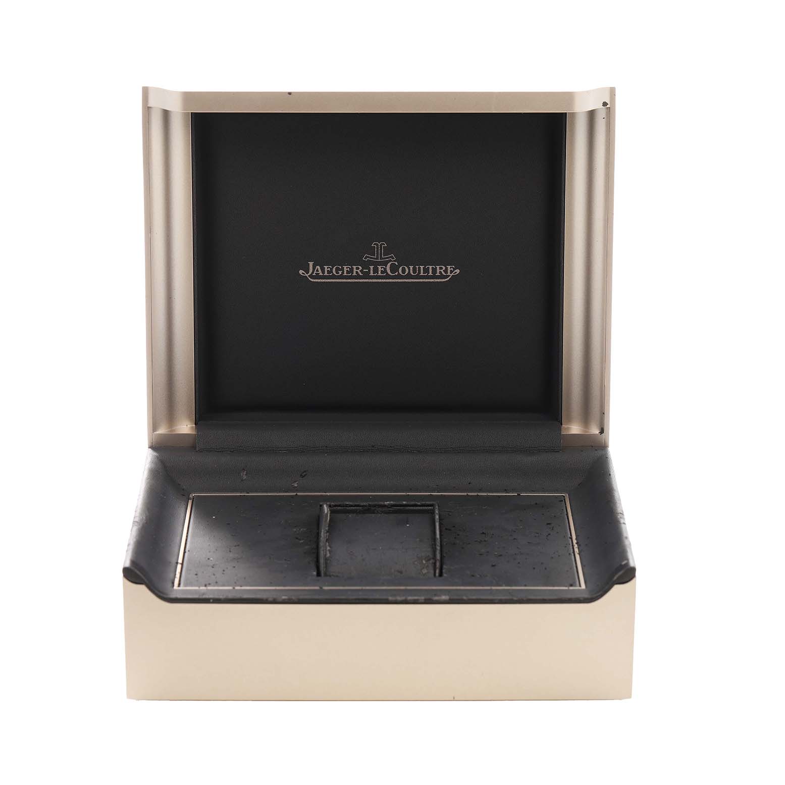 The image shows the open box of a Jaeger-LeCoultre Reverso watch, displaying its interior from a front angle.