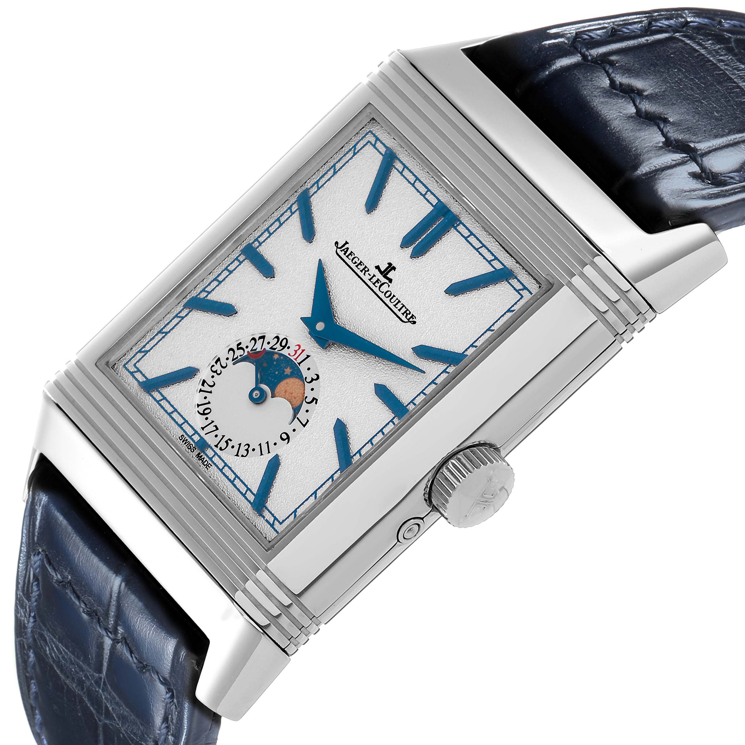 The Jaeger-LeCoultre Reverso is shown at a tilted angle, highlighting the dial, crown, and blue leather strap.
