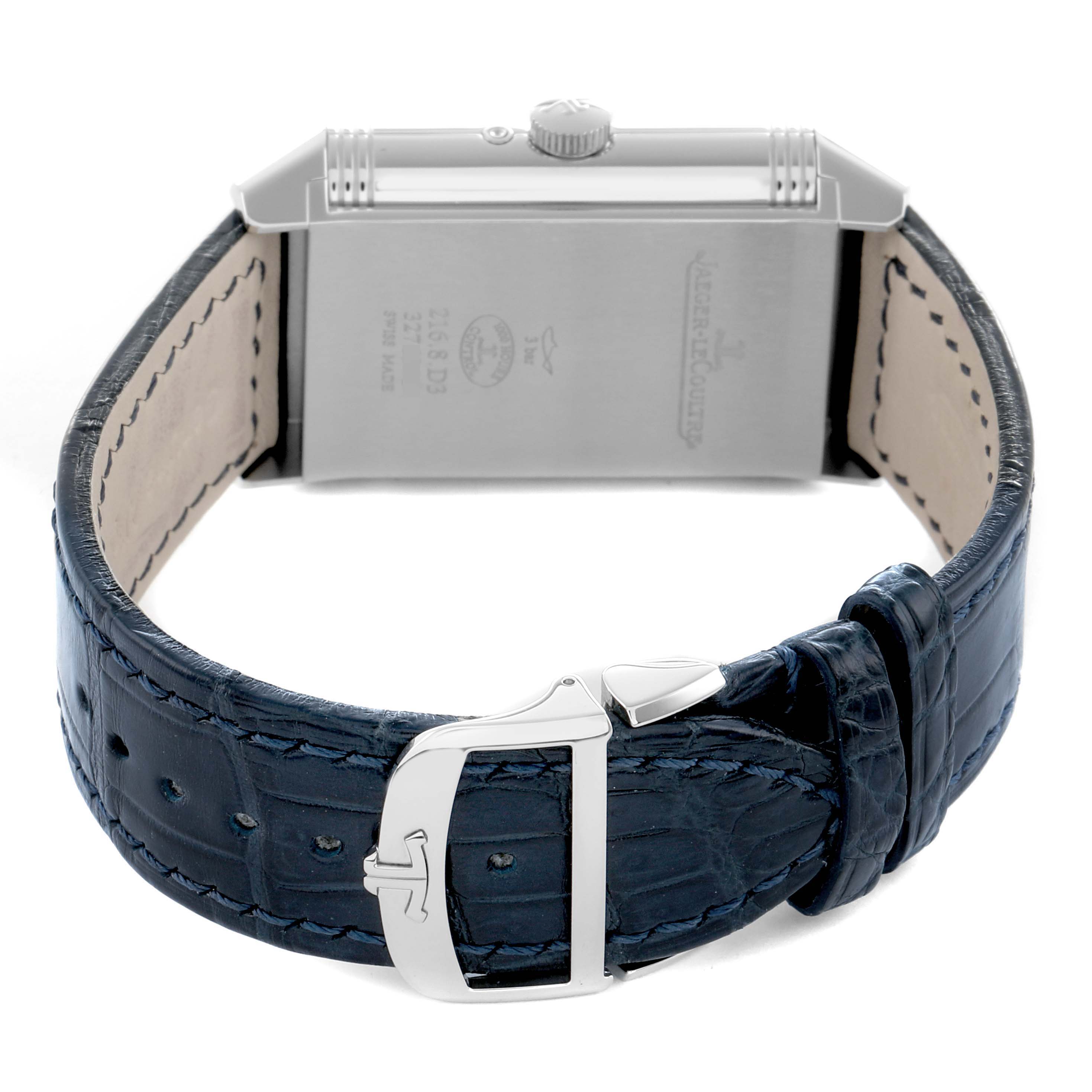 The Jaeger-LeCoultre Reverso model is shown from the back, highlighting the case, crown, and blue leather strap with a buckle.