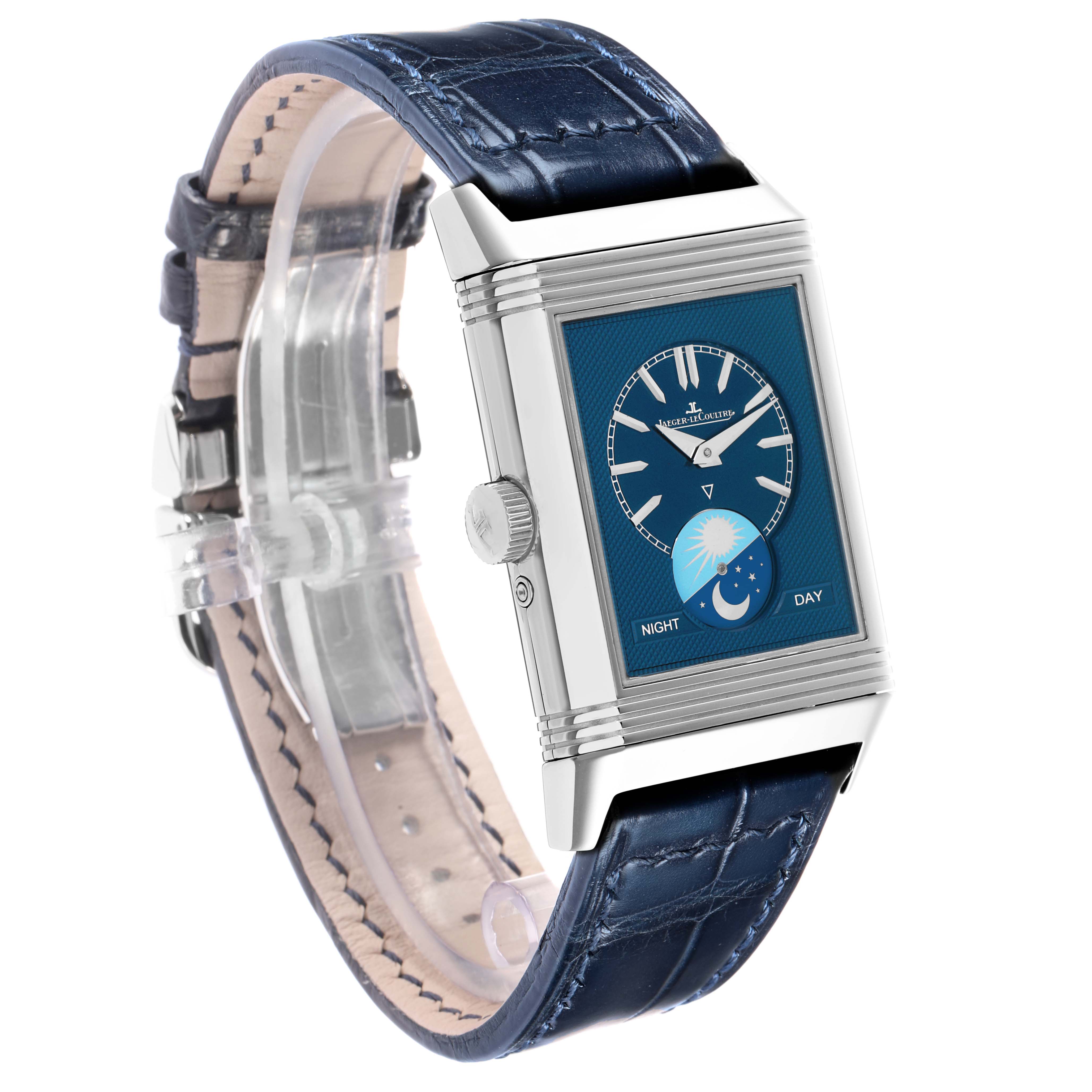 The watch is shown at an angled side view, highlighting the blue dial and strap of the Jaeger LeCoultre Reverso Q3958420 Men's Stainless Steel Silver Dial model.