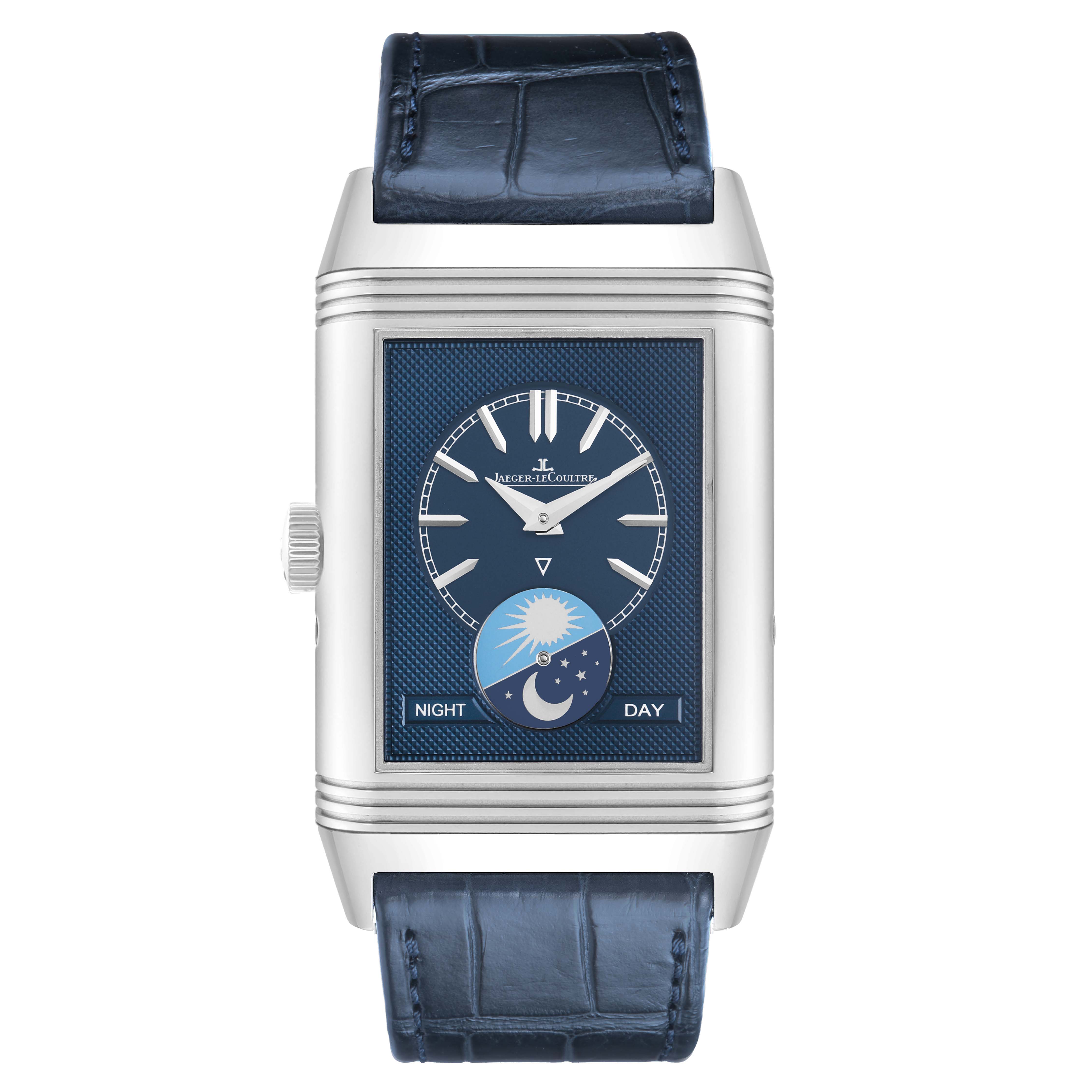 The Jaeger-LeCoultre Reverso watch is shown from the front, displaying its blue dial and day-night indicator.