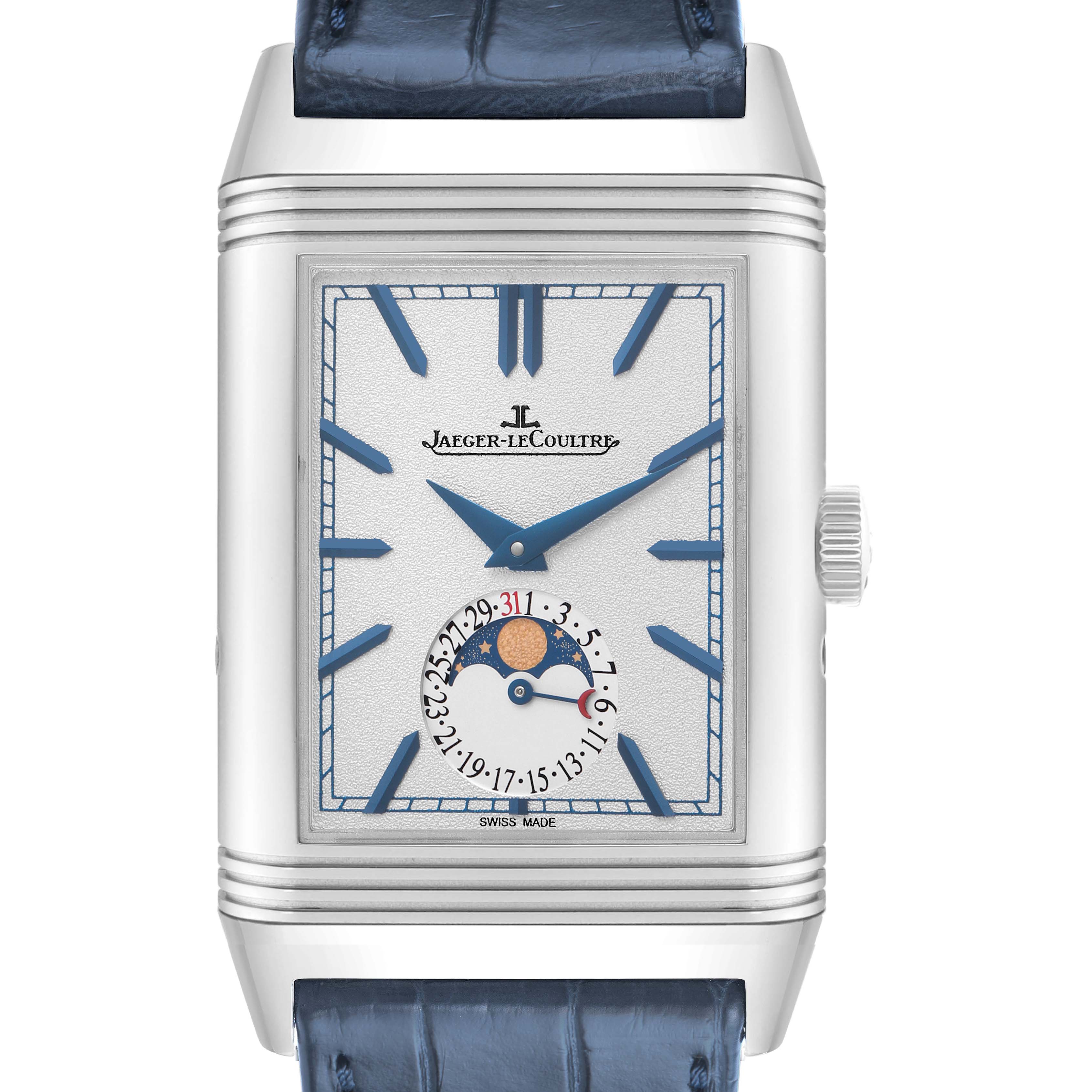 The Jaeger-LeCoultre Reverso watch is shown from a front angle, highlighting its face, moon phase, and date indicator.