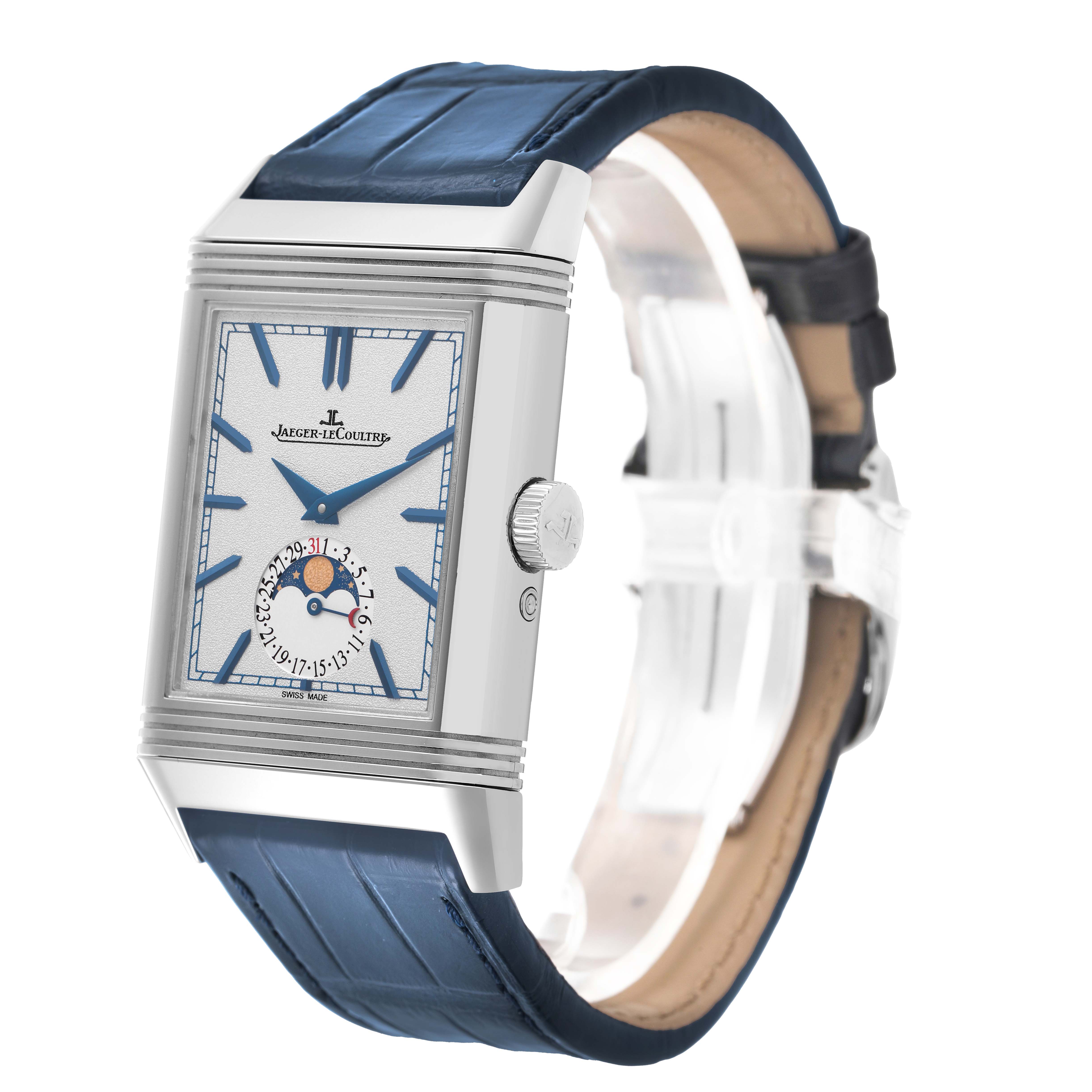 The Jaeger-LeCoultre Reverso watch is shown at a three-quarter angle, highlighting the face, rectangular case, crown, and blue leather strap.