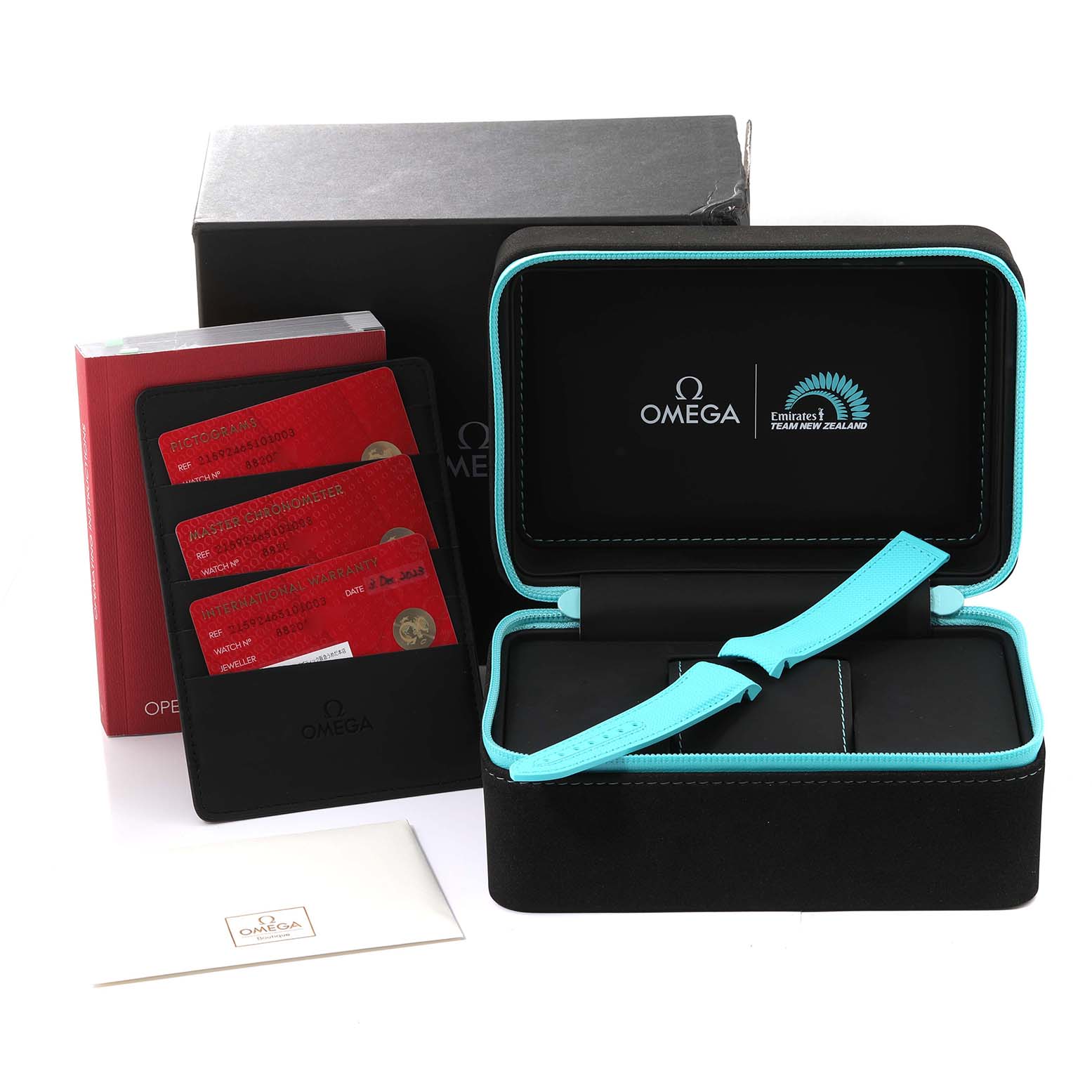 This image shows the packaging and accessories for the Omega Planet Ocean 215.92.46.51.01.003 Men's Ceramic Black Dial 215.92.46.51.01.003 Men's Ceramic Black Dial watch, including cards, an open case, and documentation.