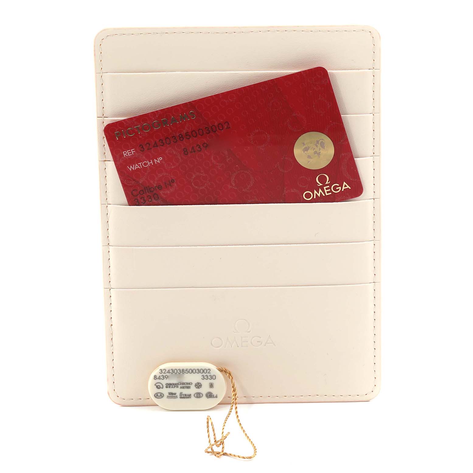 The image shows a red card and a tag for the Omega Speedmaster 324.30.38.50.03.002 Men
s Stainless Steel Blue Dial, both placed on a cream cardholder.