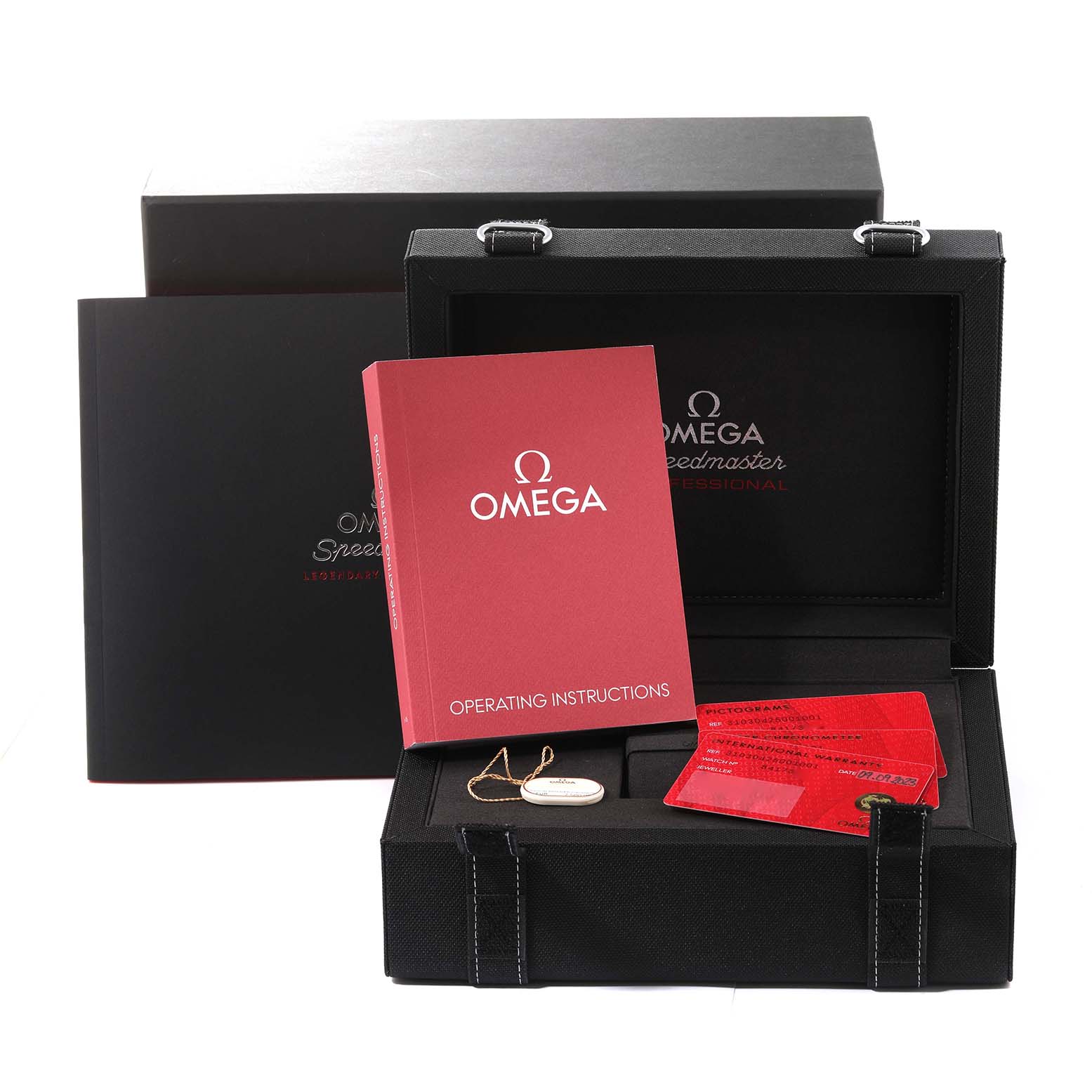 This image displays an Omega Speedmaster 310.30.42.50.01.001 Men
s Stainless Steel Black Dial 310.30.42.50.01.001 Men
s Stainless Steel Black Dial box, operating instructions, warranty cards, and a tag.