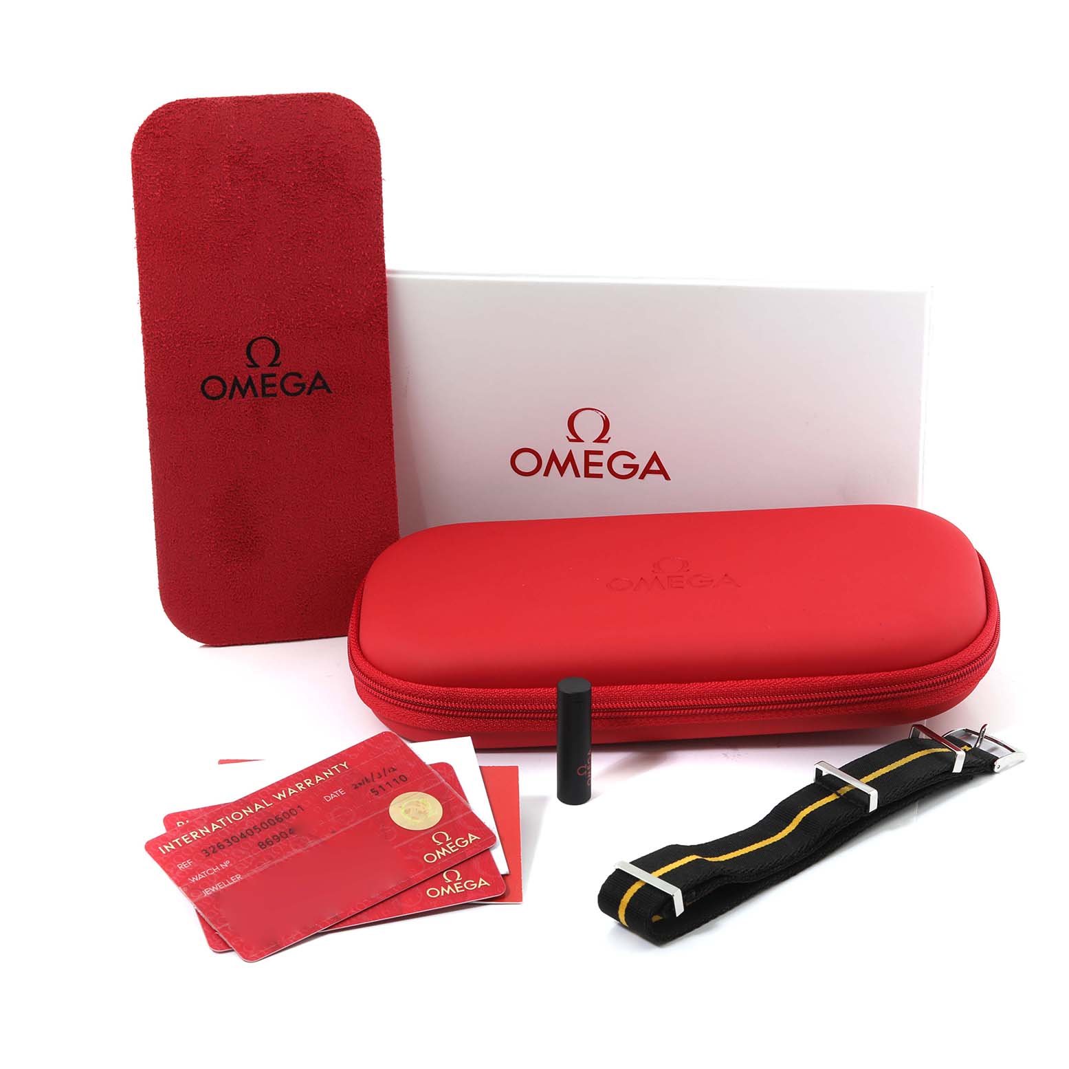 The image shows the Omega Speedmaster 326.30.40.50.06.001 Men's Stainless Steel Grey Dial 326.30.40.50.06.001 Men's Stainless Steel Grey Dial accessories, including a red case, warranty cards, a strap, and tool from a front angle.