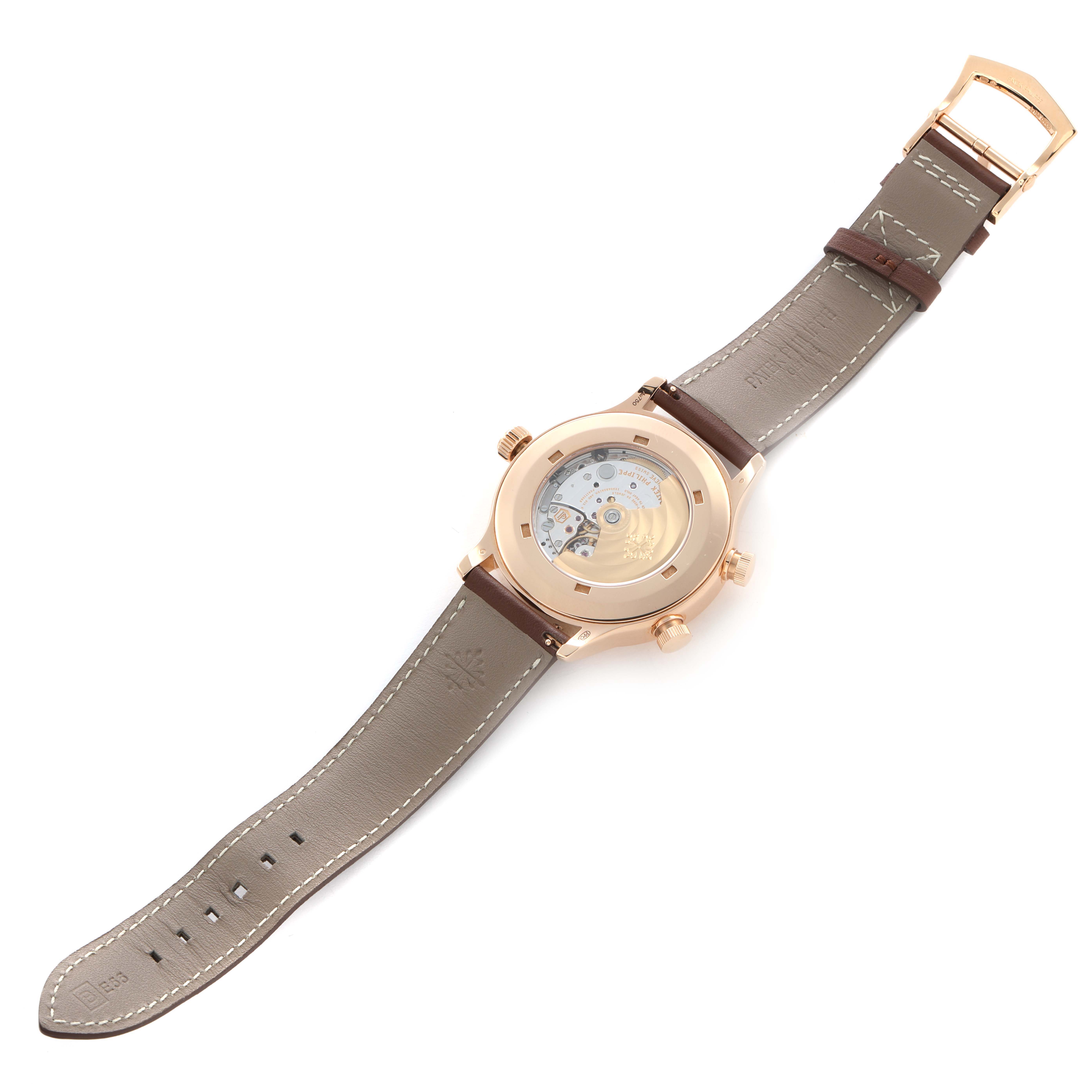 The Patek Philippe Calatrava 5524R-001 Men
s Rose Gold Brown Dial watch is shown from the back, displaying the movement and brown leather strap.