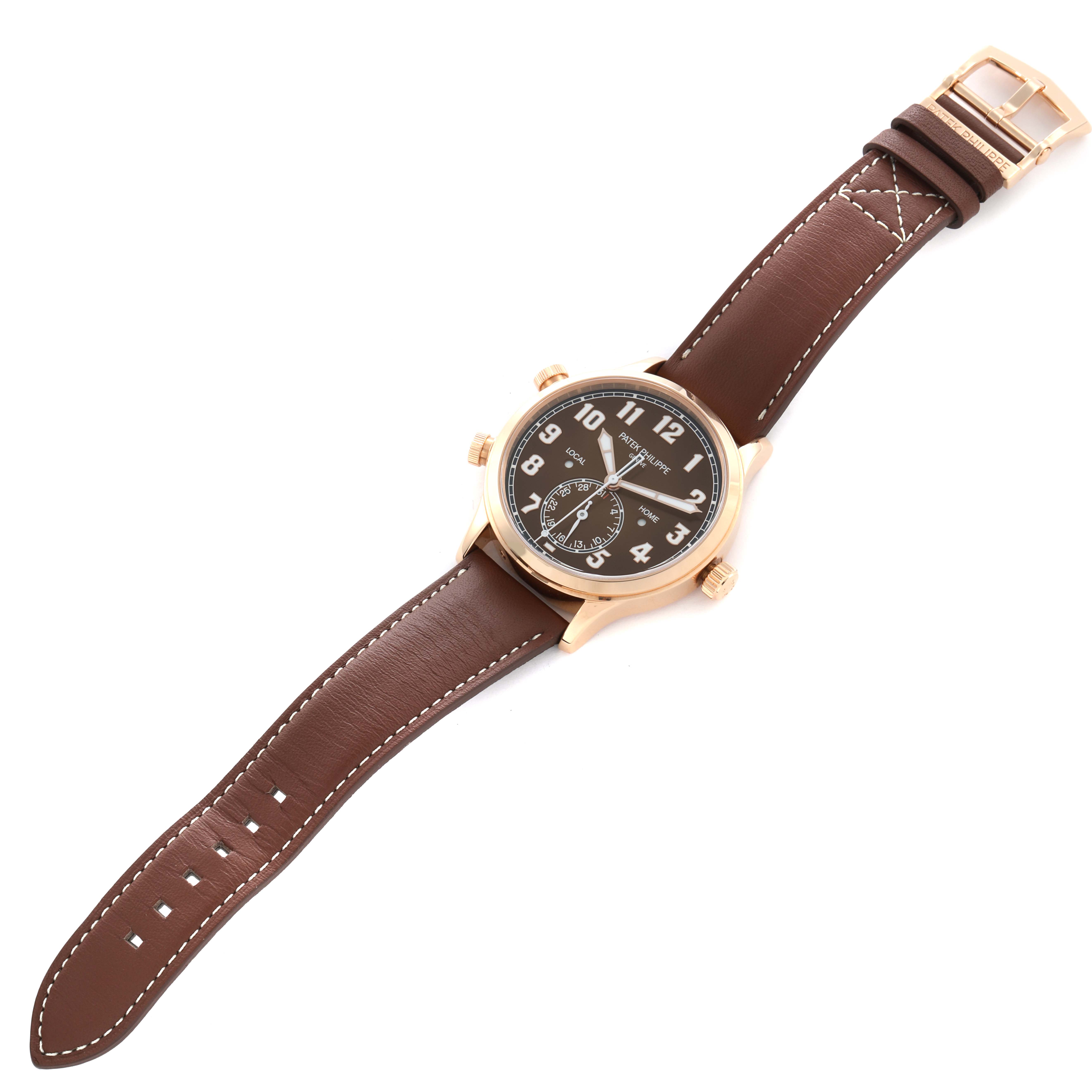 The image shows a Patek Philippe Calatrava 5524R-001 Men
s Rose Gold Brown Dial watch from a top-down angle, highlighting the brown leather strap, dial, and case.