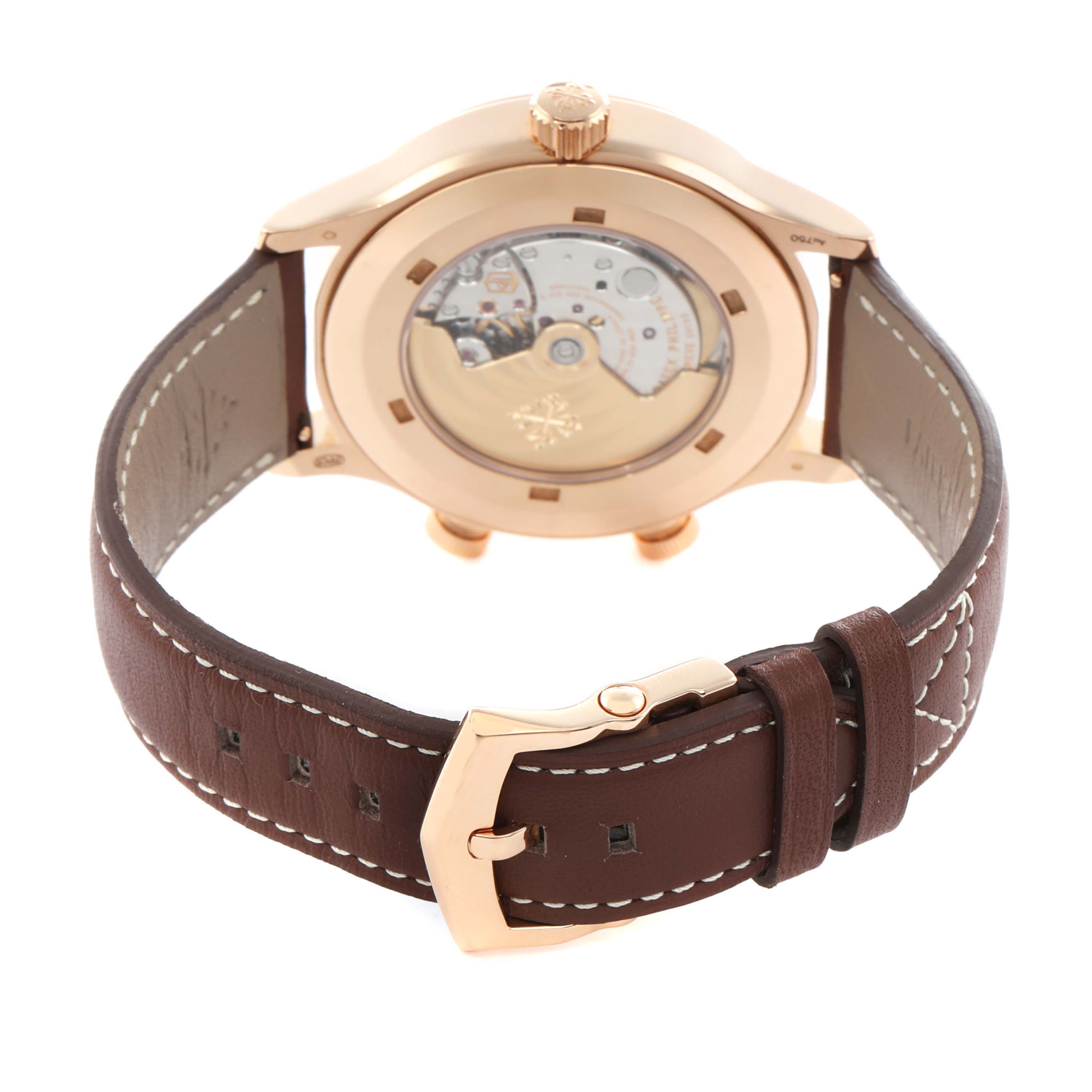 The Patek Philippe Calatrava 5524R-001 Men
s Rose Gold Brown Dial watch is shown from the back, highlighting its transparent case back and leather strap.