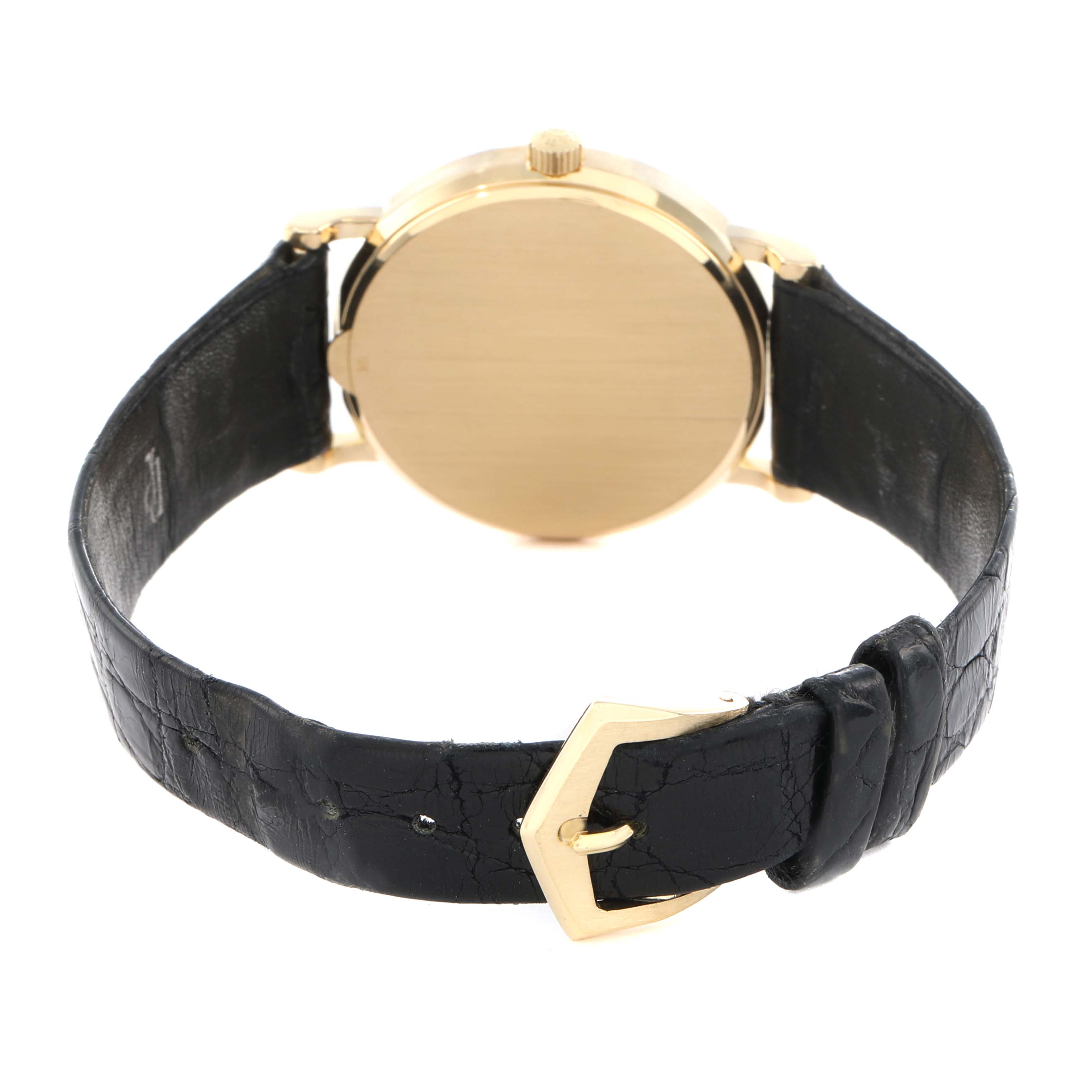 The Patek Philippe Calatrava 3802J Men
s Yellow Gold White Dial watch is shown from the back, highlighting the case, crown, and black leather strap with a gold buckle.