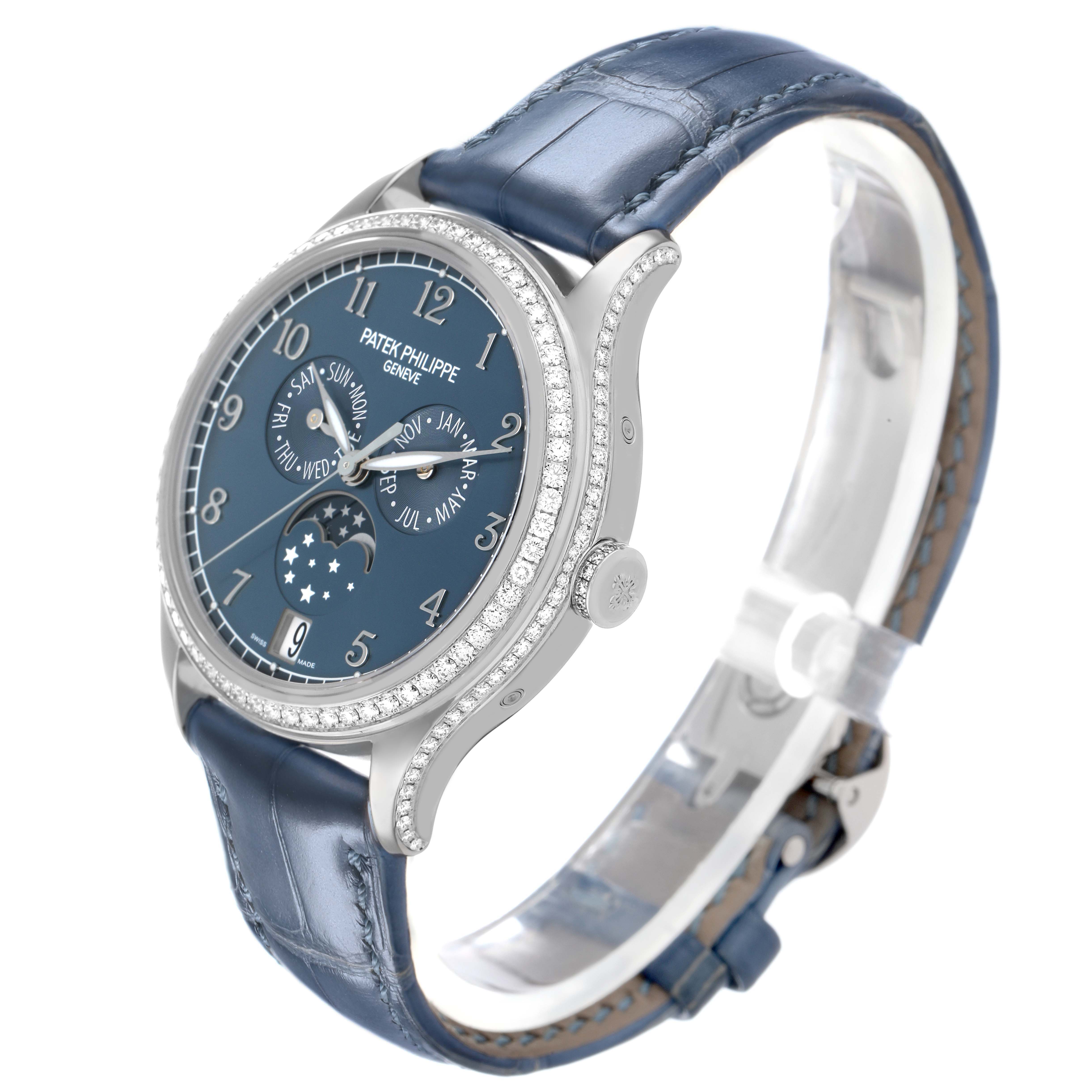 The Patek Philippe Complications 4947G-001 Mens White Gold Blue Dial watch is shown at a three-quarter angle, highlighting the face, bezel, and strap.