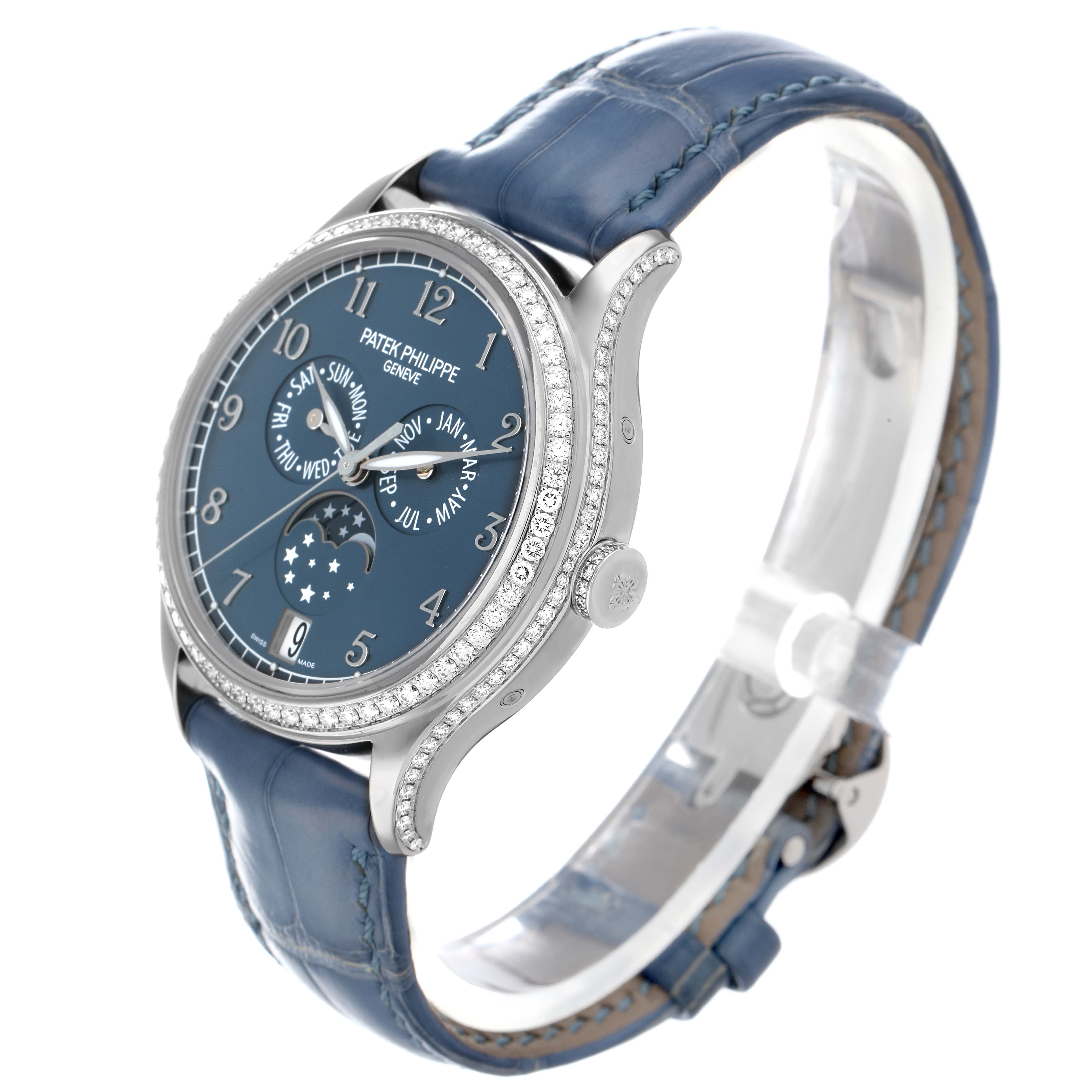 The Patek Philippe Complications 4947G-001 Men
s White Gold Blue Dial watch is shown at a three-quarter angle, highlighting the dial, bezel, and part of the strap.