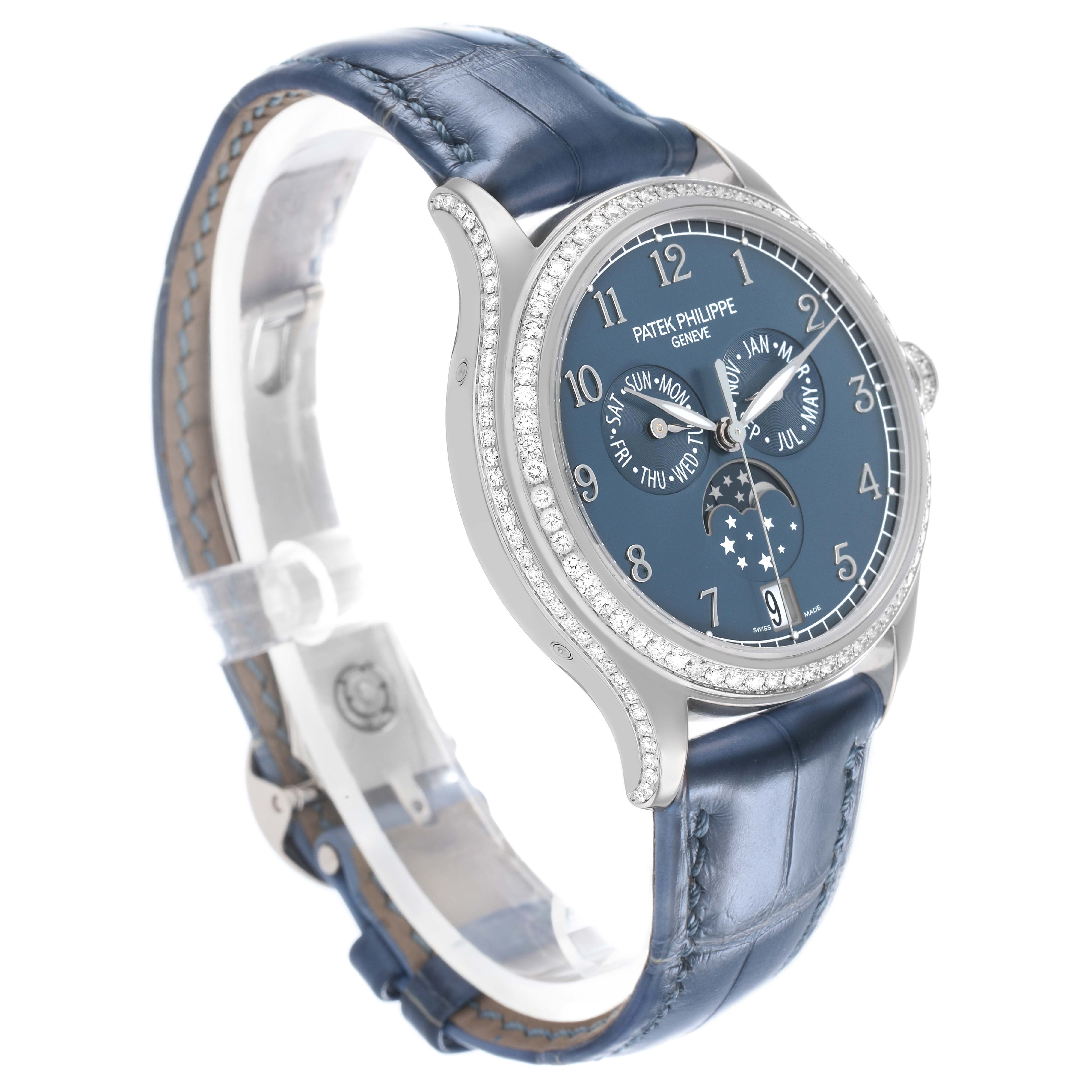 The image shows a Patek Philippe Complications 4947G-001 Mens White Gold Blue Dial model at a left-side angle highlighting its blue dial, diamonds, and leather strap.