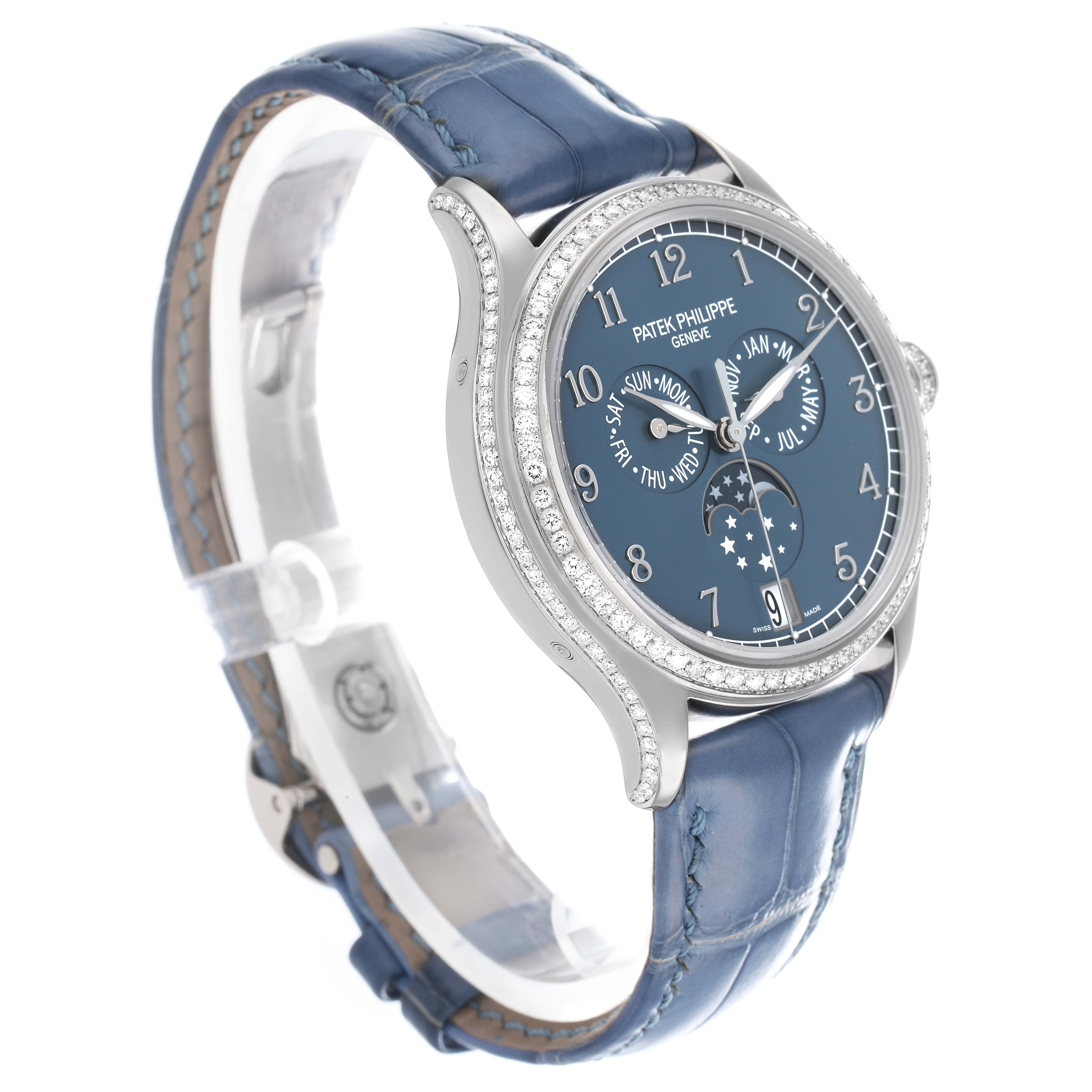 The Patek Philippe Complications 4947G-001 Men
s White Gold Blue Dial watch is shown at a three-quarter angle, displaying the blue face, leather strap, and diamond bezel.