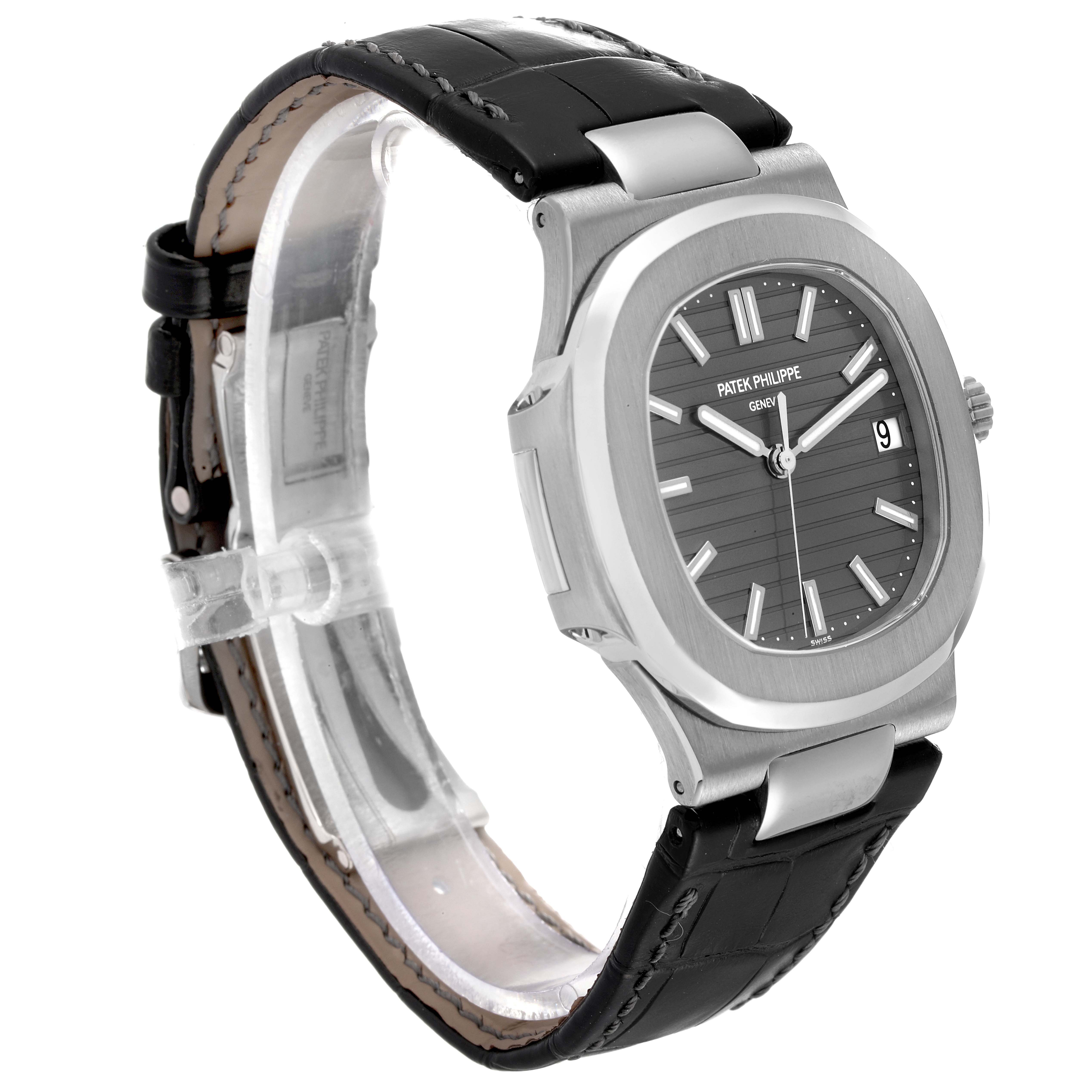 The image shows a side-angle view of the Patek Philippe Nautilus 5711G-001 Men's White Gold Grey Dial 5711G-001 Men's White Gold Grey Dial watch, displaying the watch face, case, and strap.