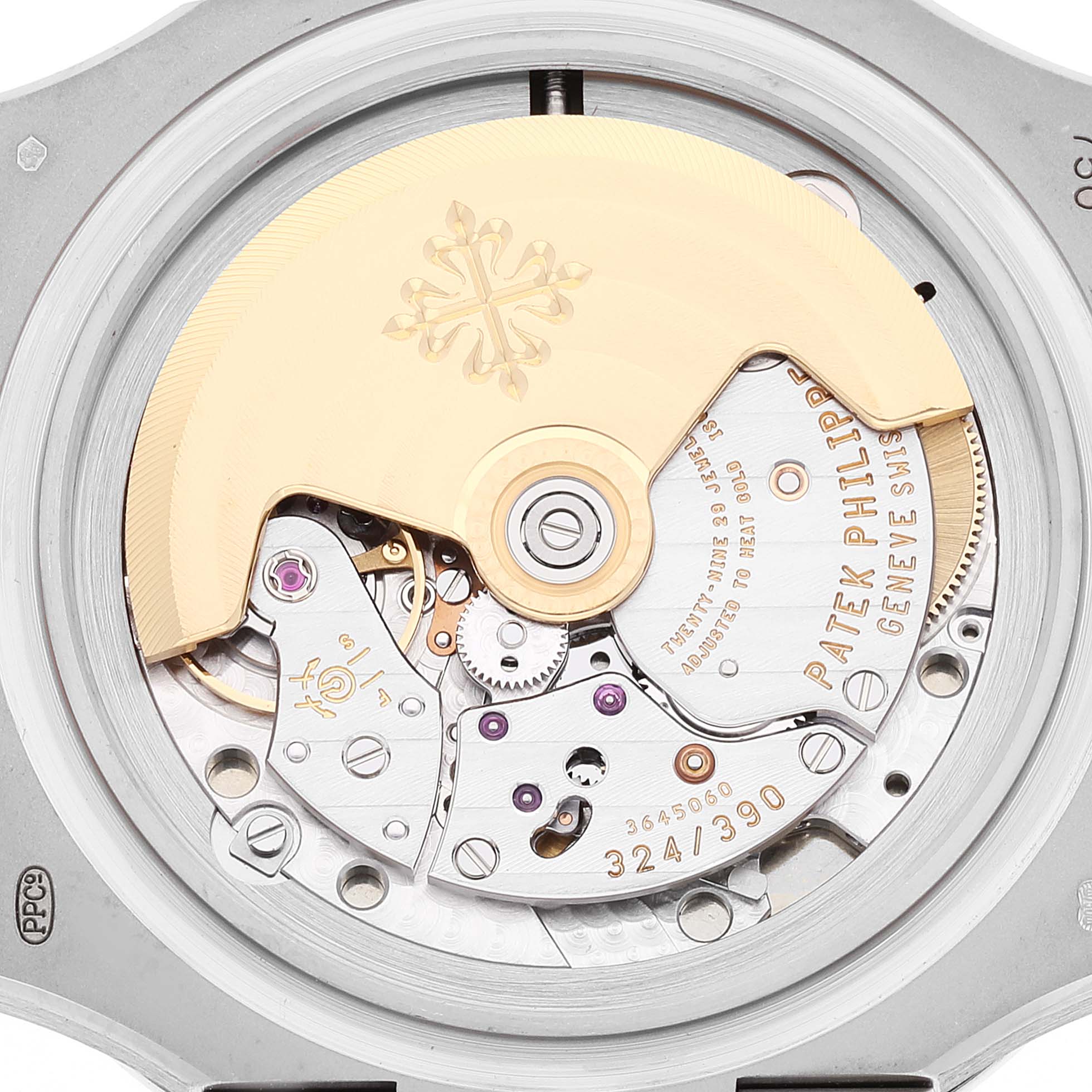 This image shows a close-up of the movement mechanism of a Patek Philippe Nautilus 5711G-001 Men's White Gold Grey Dial 5711G-001 Men's White Gold Grey Dial watch, highlighting the rotor and intricate gears.