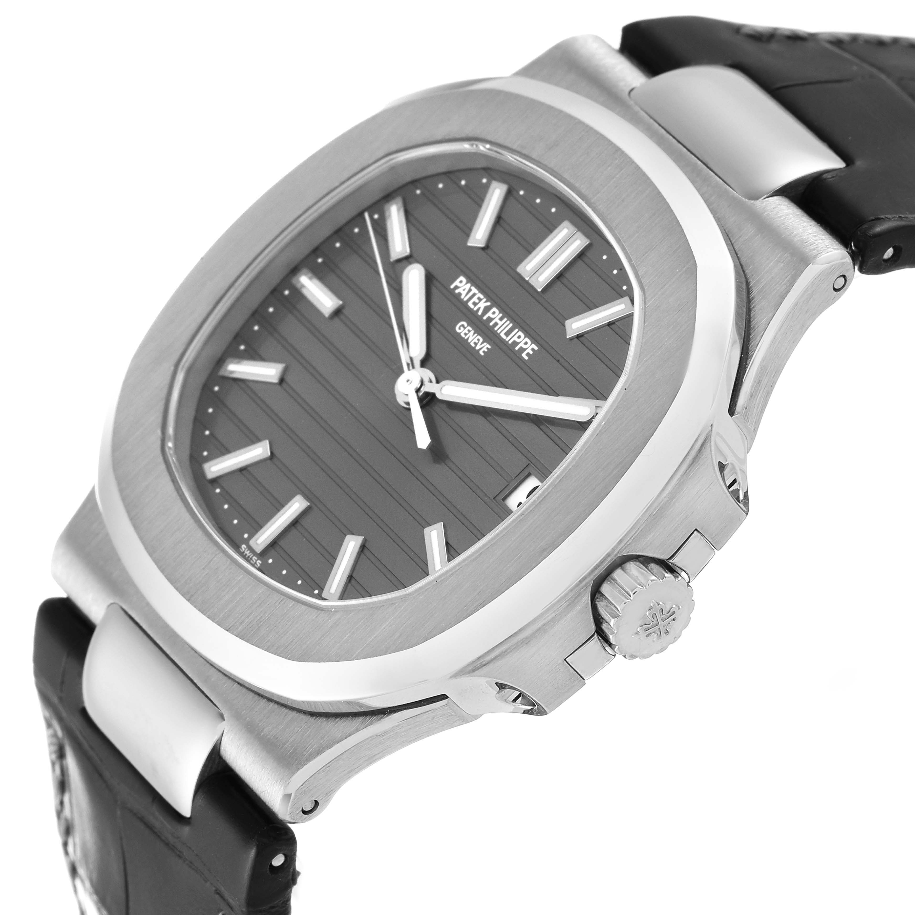 The image shows a close-up angled view of a Patek Philippe Nautilus 5711G-001 Men's White Gold Grey Dial 5711G-001 Men's White Gold Grey Dial watch, highlighting the bezel, crown, and part of the strap.