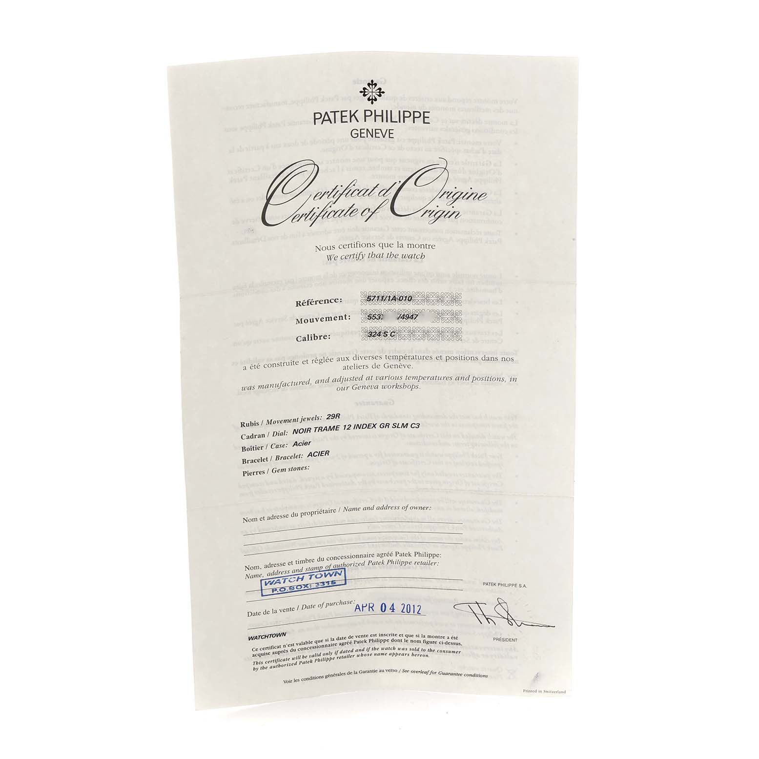 This image shows a Certificate of Origin for the Patek Philippe Nautilus 5711/1A-010 Men
s Stainless Steel Blue Dial model, displaying details like reference and movement number.