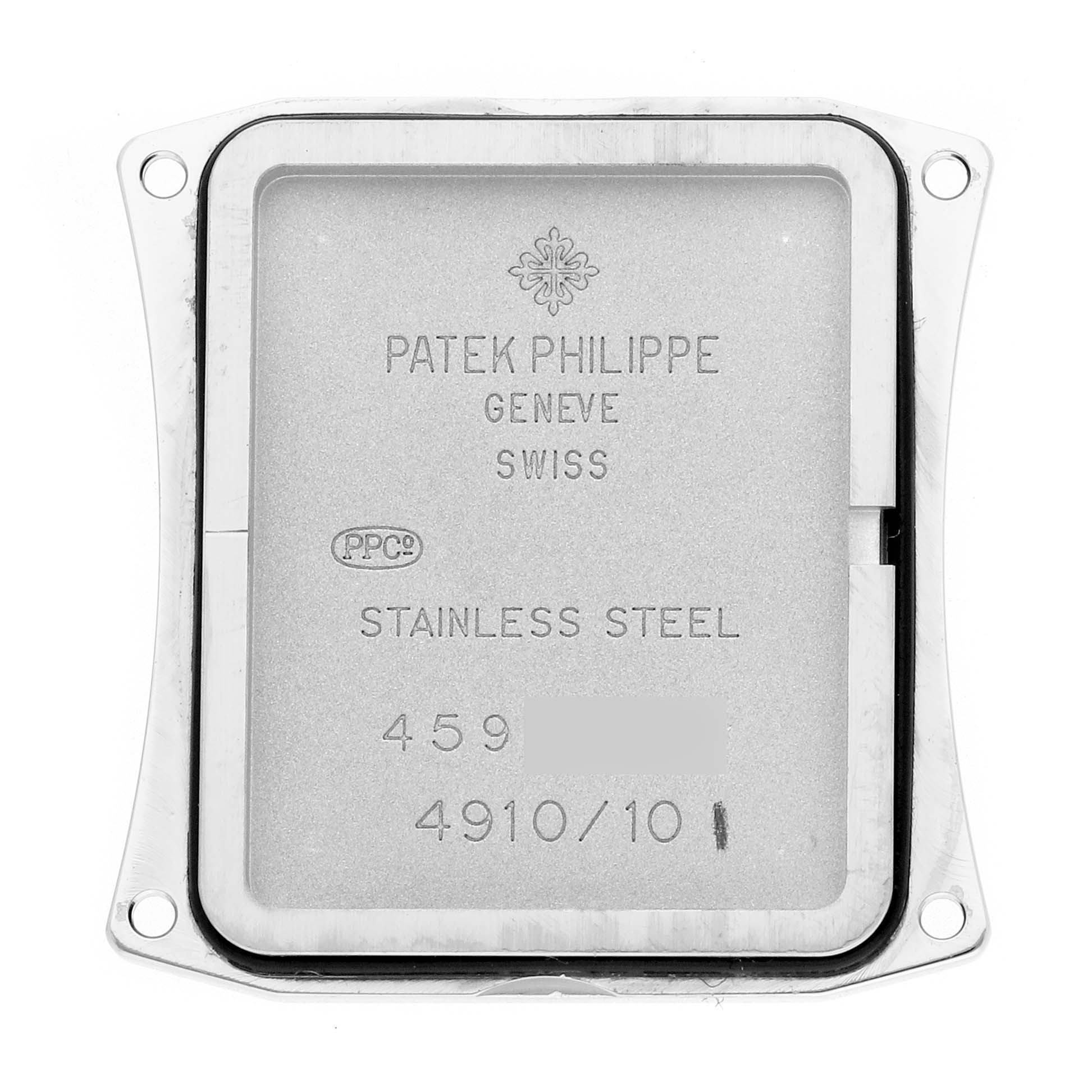 The image shows the back plate of a Patek Philippe Twenty-4 4910 Women
s Stainless Steel Black Dial watch, highlighting its stainless steel material and engraving.