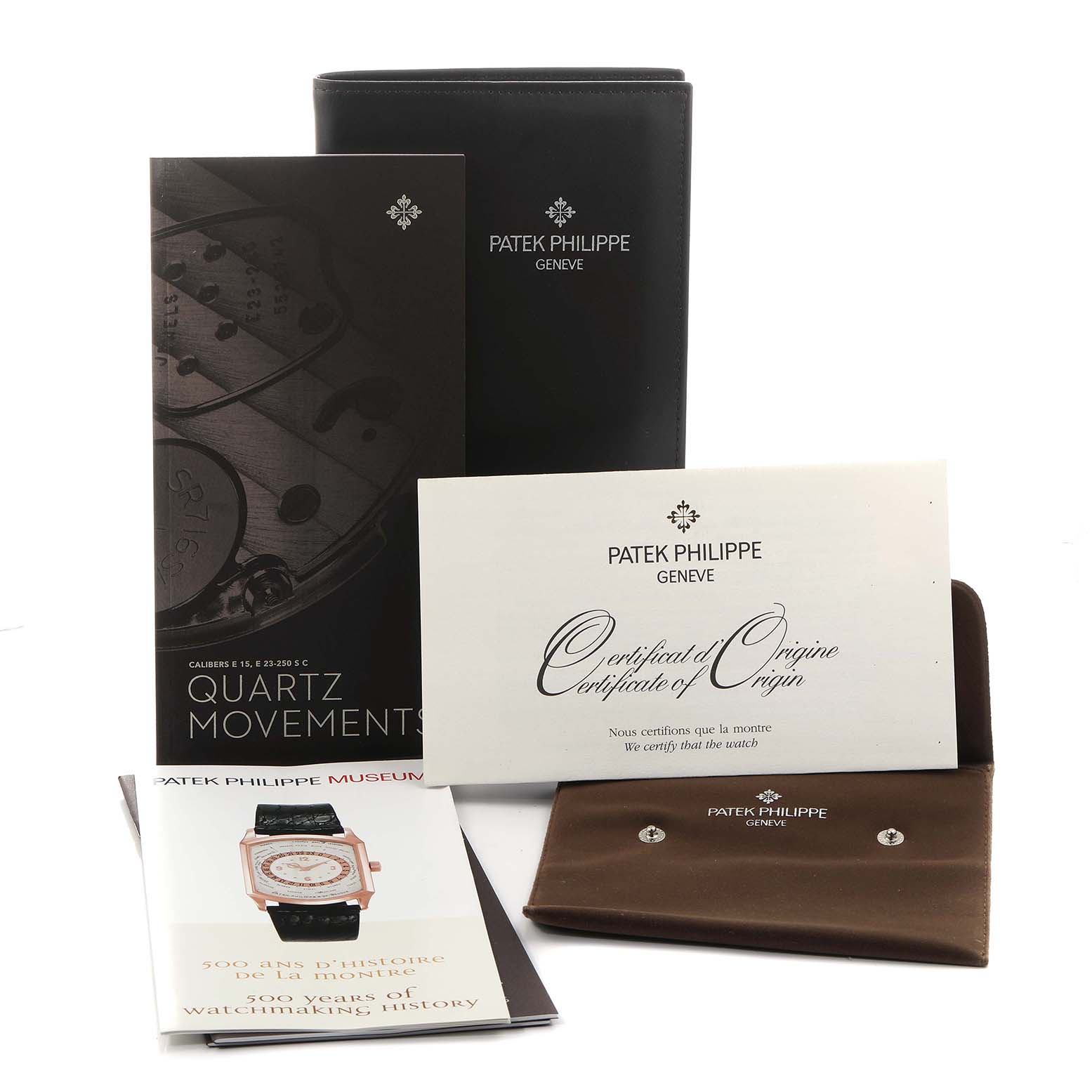 The image shows Patek Philippe's Twenty-4 model accessories, including a certificate, booklets, and a leather case, viewed from the front.