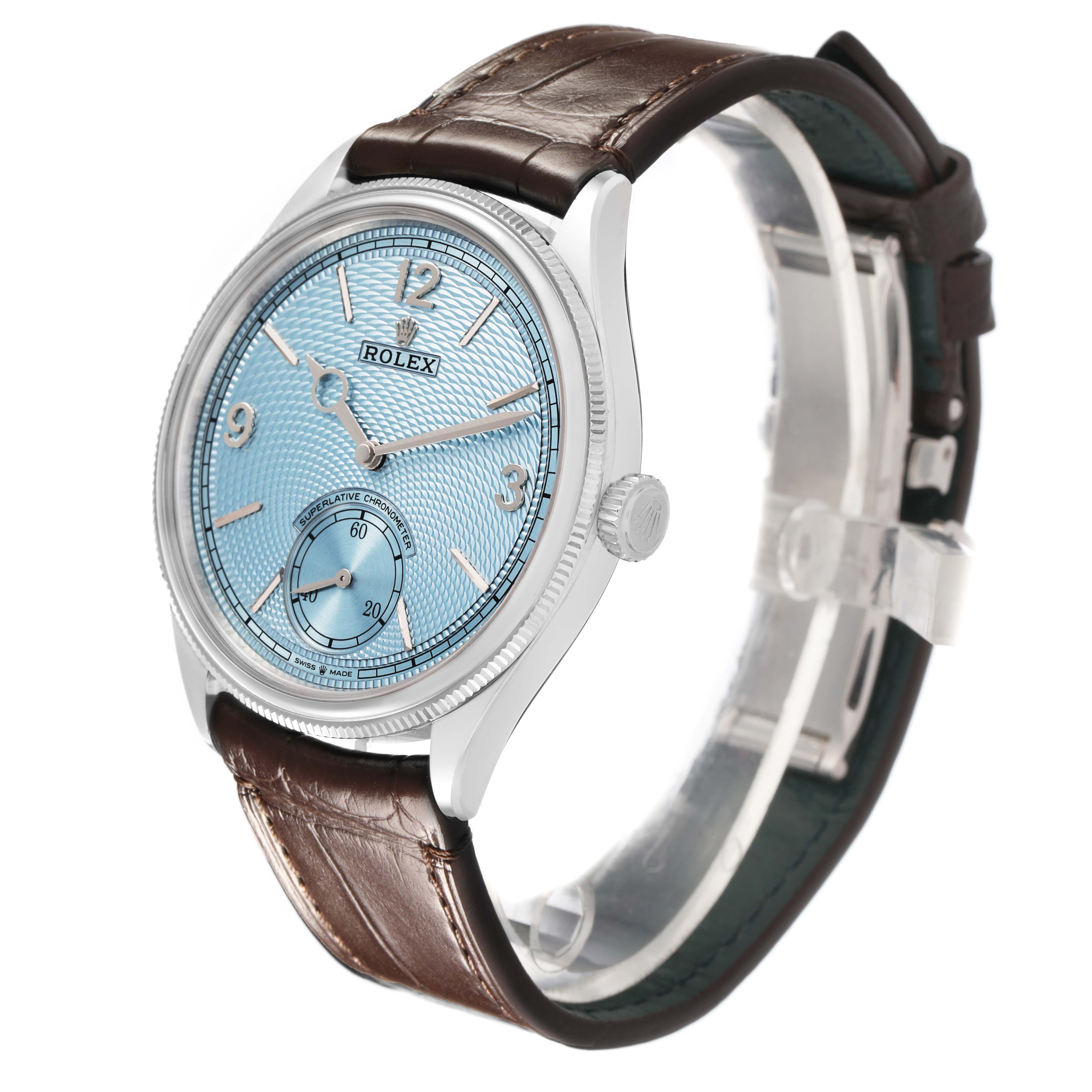 The Rolex 1908 52506 Men's Platinum Blue Dial model watch is shown at a three-quarter angle, highlighting the dial, bezel, crown, and leather strap.