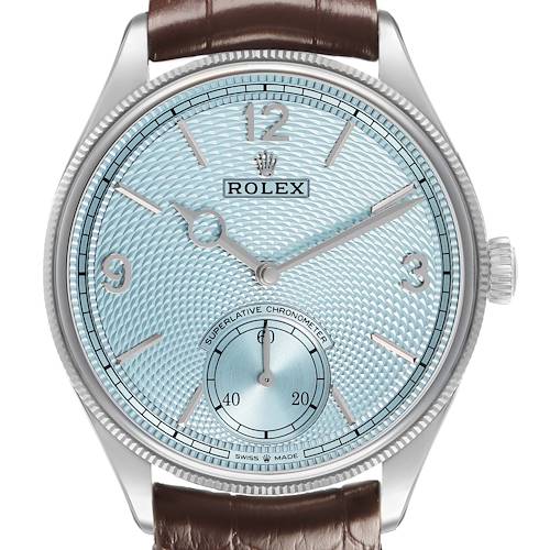 The 1908 Rolex watch is shown from a frontal angle, displaying the dial, crown, and leather strap.