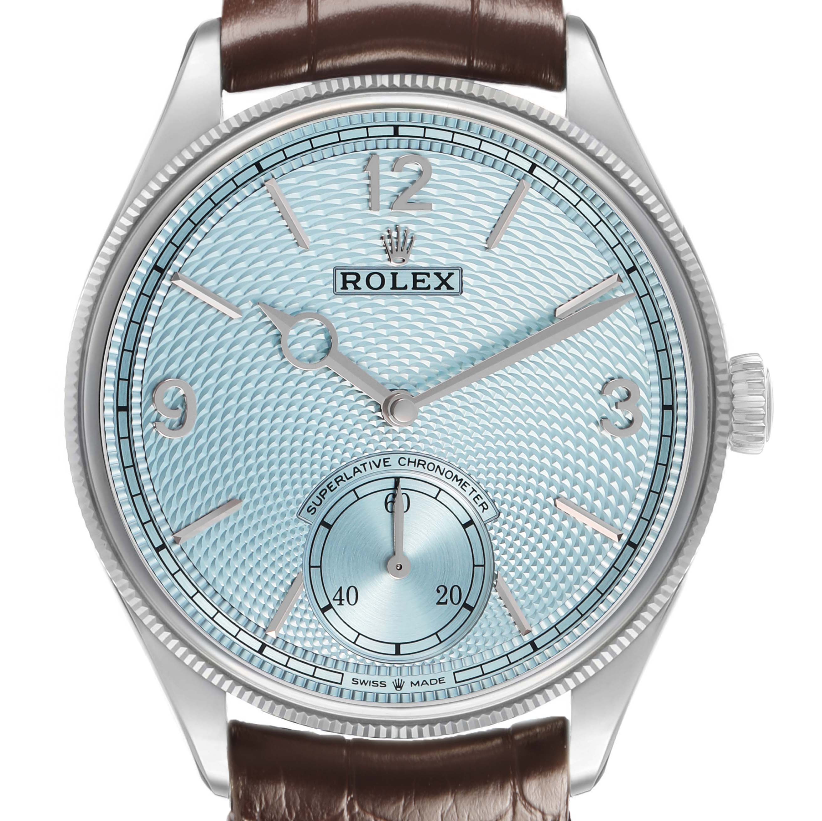 The Rolex 1908 52506 Men's Platinum Blue Dial model is shown from a frontal angle, highlighting its textured dial, hands, numerals, and leather strap.