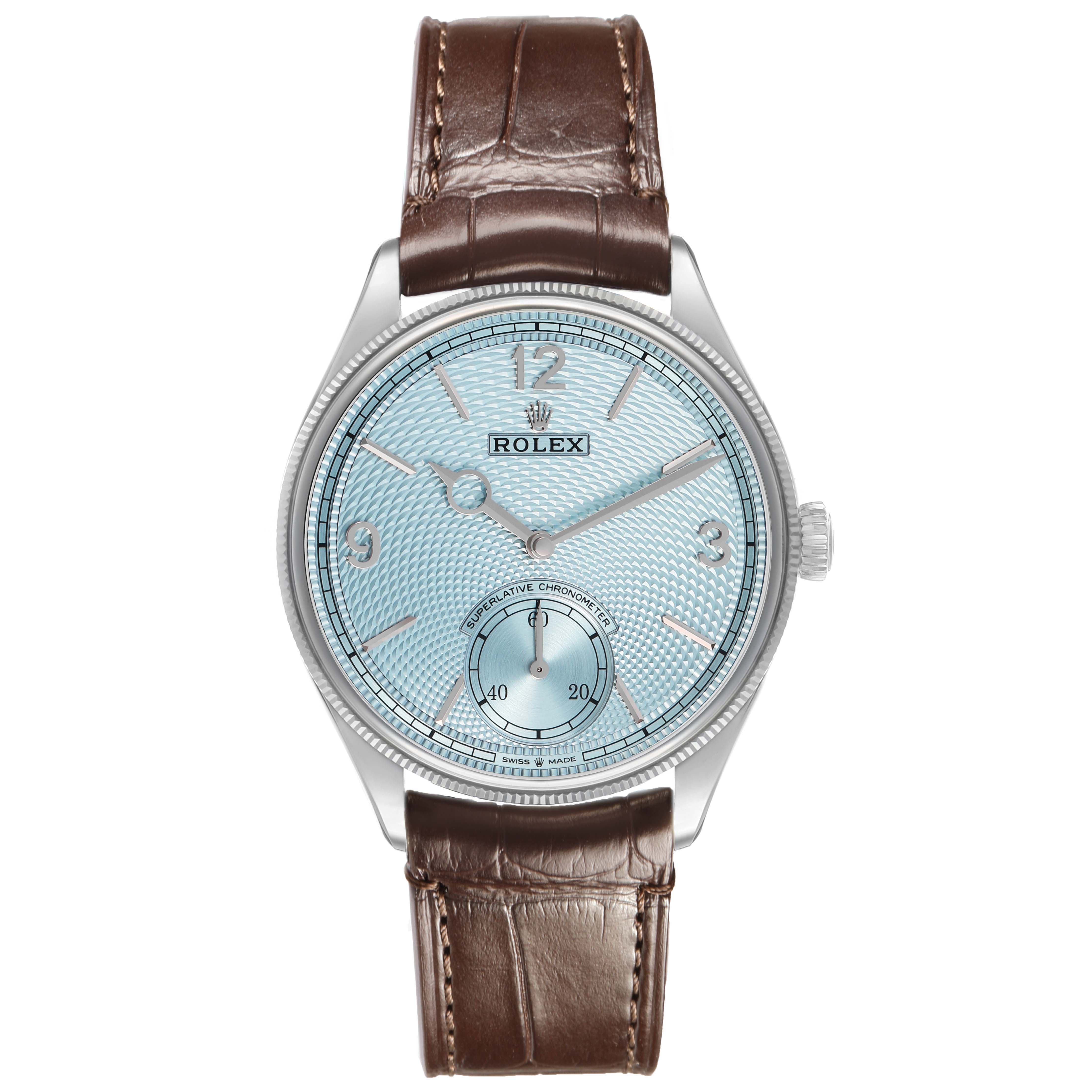The Rolex 1908 52506 Men's Platinum Blue Dial model is shown from the front, featuring a blue dial, markers, hands, sub-dial, and a brown leather strap.