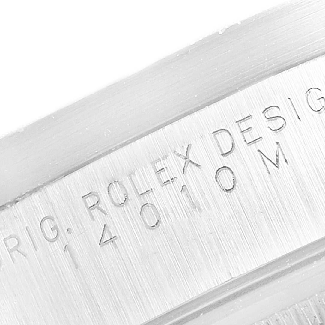 This image shows a close-up of the engraved text on the casing of a Rolex Air-King 14010 Men's Stainless Steel Blue Dial 14010 Men's Stainless Steel Blue Dial watch.