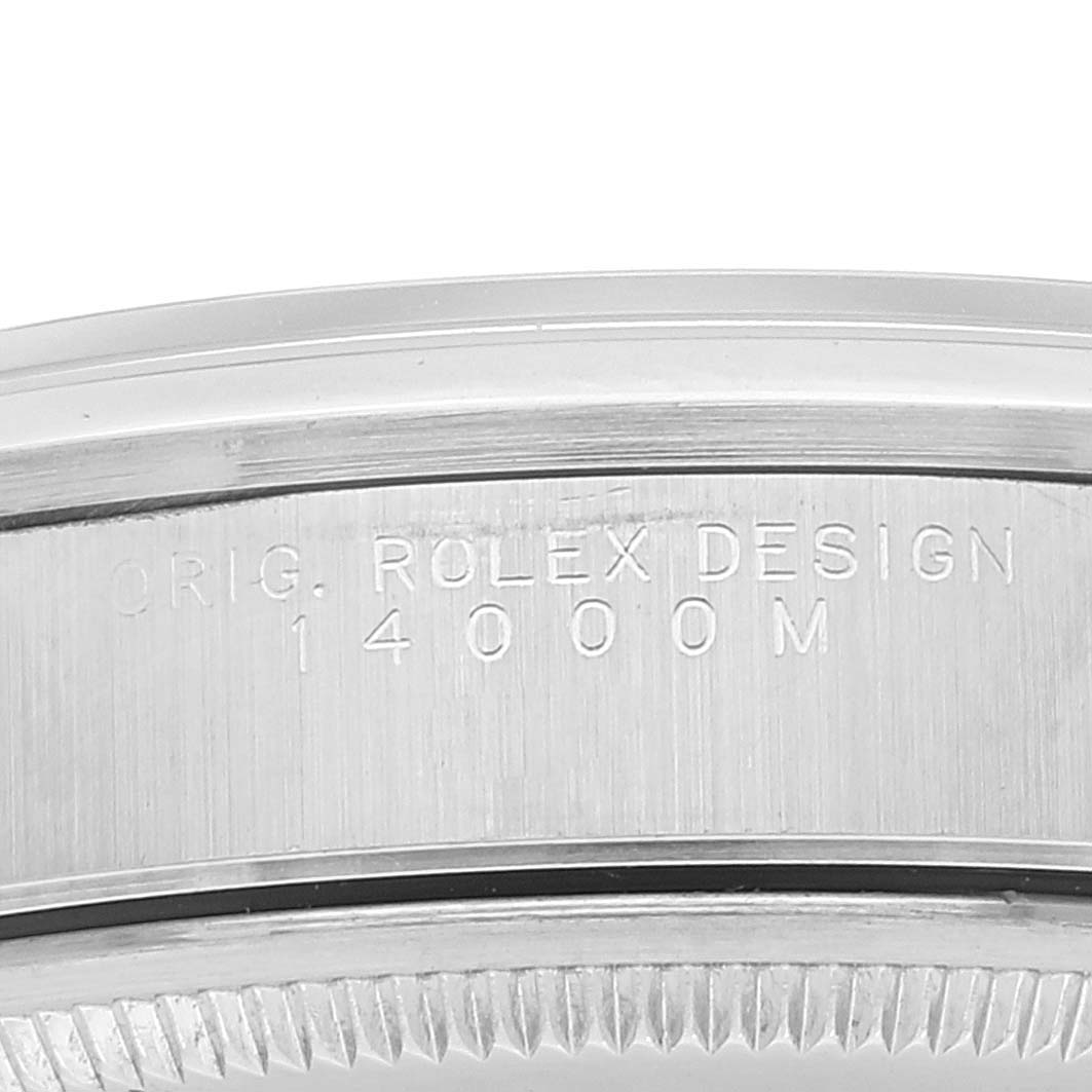 This close-up image shows the edge of the bezel and side of the case of a Rolex Air-King 14000 Men's Stainless Steel Pink Dial 14000 Men's Stainless Steel Pink Dial model, with "ROLEX DESIGN 14000M" engraved.