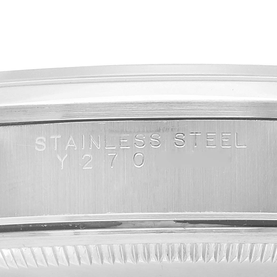 The image shows a close-up of the stainless steel casing of a Rolex Air-King 14000 Men's Stainless Steel Pink Dial 14000 Men's Stainless Steel Pink Dial watch with visible engravings.