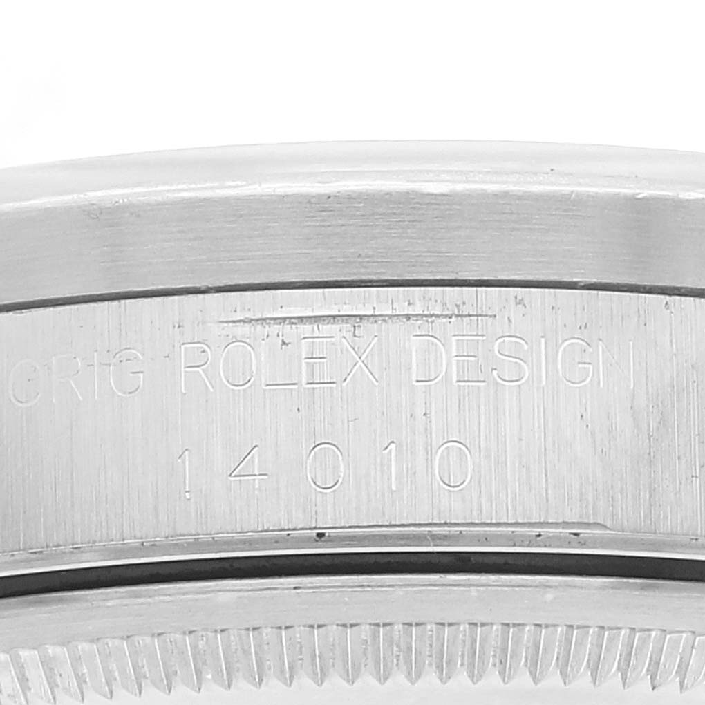 Close-up of the side engraving on a Rolex Air-King 14010 Men's Stainless Steel Silver Dial 14010 Men's Stainless Steel Silver Dial watch, showing "ROLEX DESIGN" and the model number "14010".