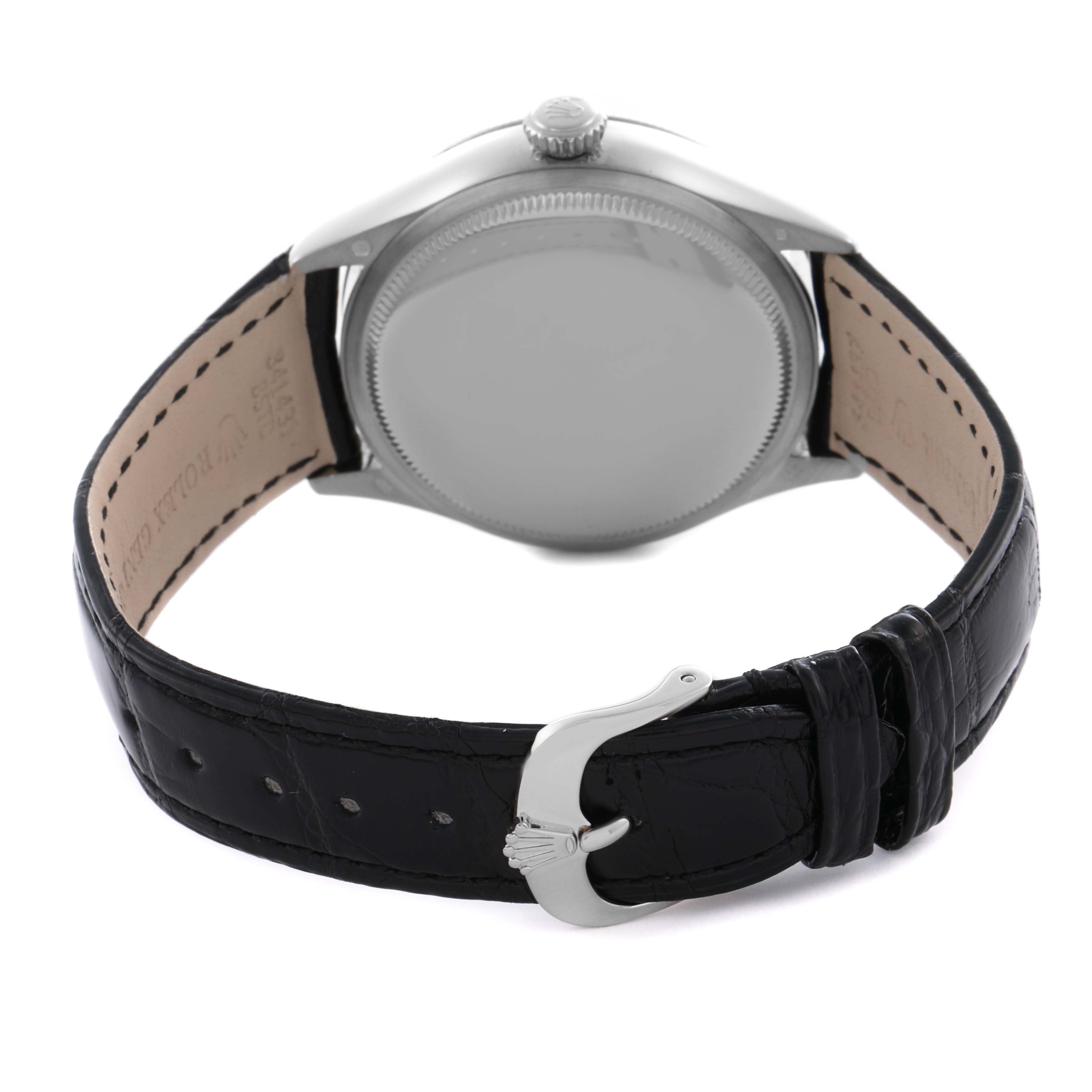 The image shows the back view of a Rolex Cellini 50529 Men's White Gold Silver Dial watch with the case back, crown, and black leather strap.