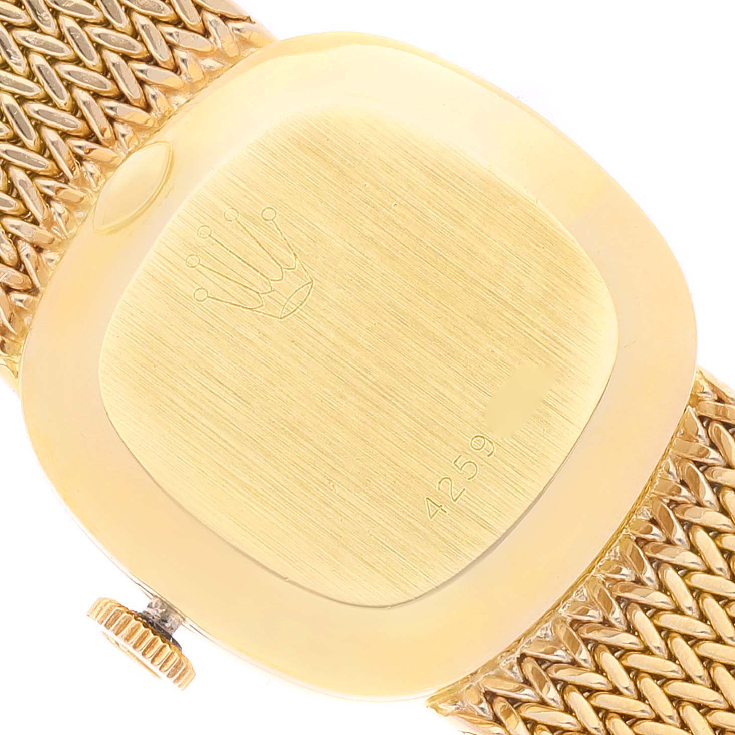The image shows the back case and crown of a Rolex Cocktail 2672 Women's Yellow Gold Silver Dial 2672 Women's Yellow Gold Silver Dial model watch, with part of its gold mesh strap visible.