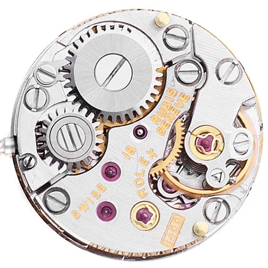 This image shows the internal mechanical movement of a Rolex Cocktail 2672 Women's Yellow Gold Silver Dial 2672 Women's Yellow Gold Silver Dial model watch, highlighting gears and components.