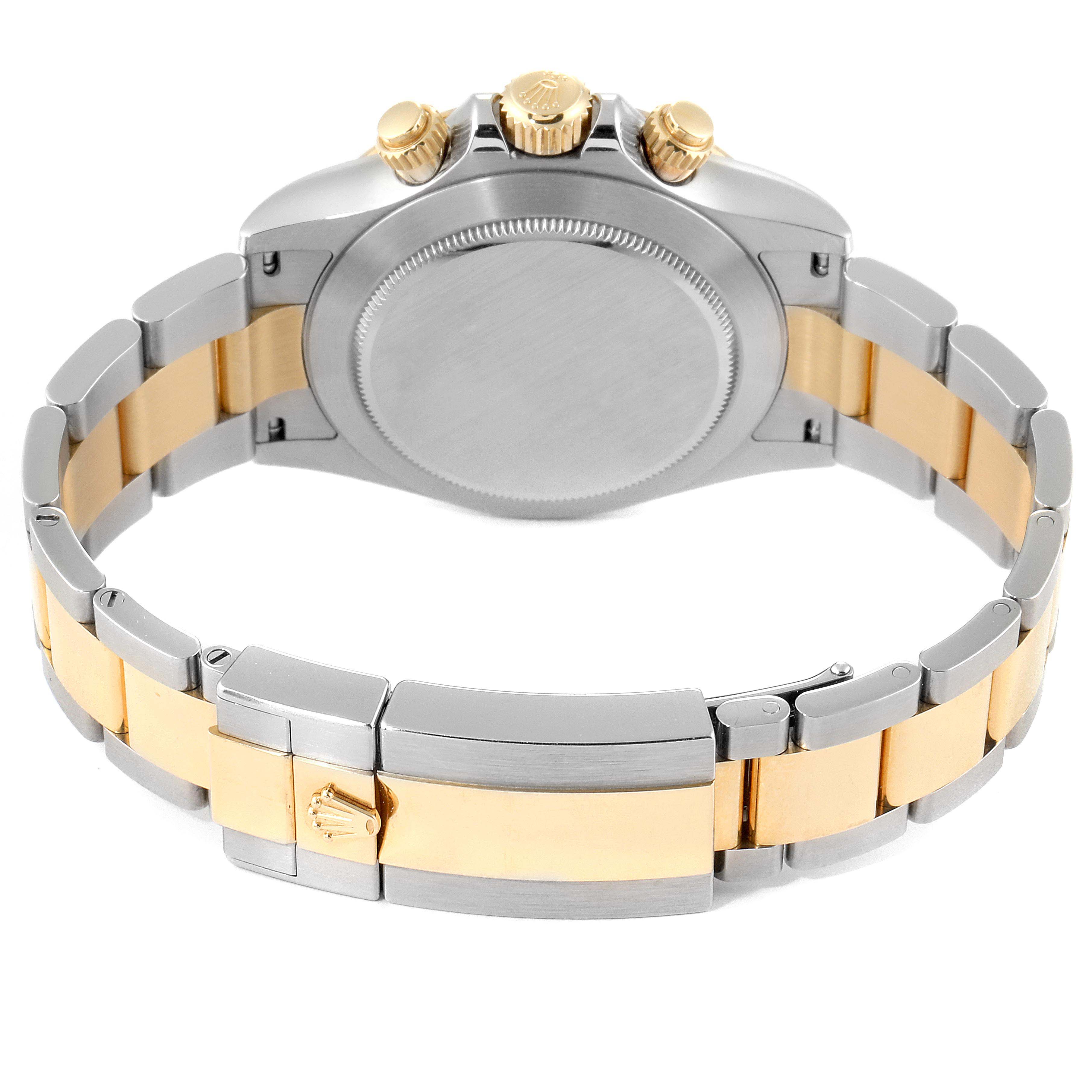 This image shows the back view of a Rolex Daytona 116503 Men's Steel and Gold (two tone) Champagne Dial 116503 Men's Steel and Gold (two tone) Champagne Dial watch, highlighting its metal bracelet and clasp.