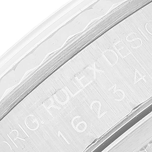 This image shows a close-up of the engraved bezel of a Rolex Datejust 16234 Men's Stainless Steel Silver Dial 16234 Men's Stainless Steel Silver Dial watch.
