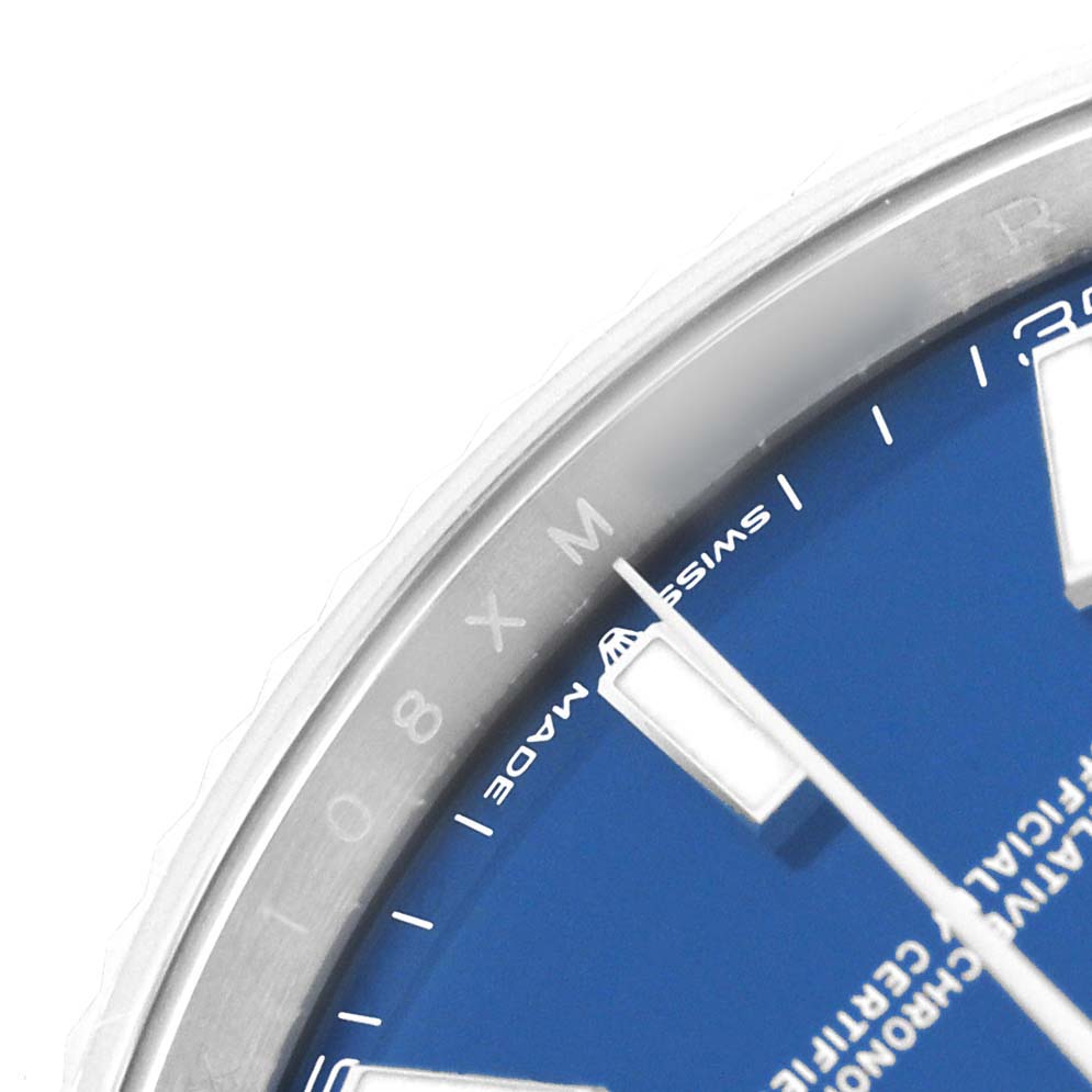 The image shows a close-up of the Rolex Datejust 41 126334 Men's Stainless Steel Blue Dial's blue dial, highlighting the hour markers, minute hand, and "Swiss Made" text.
