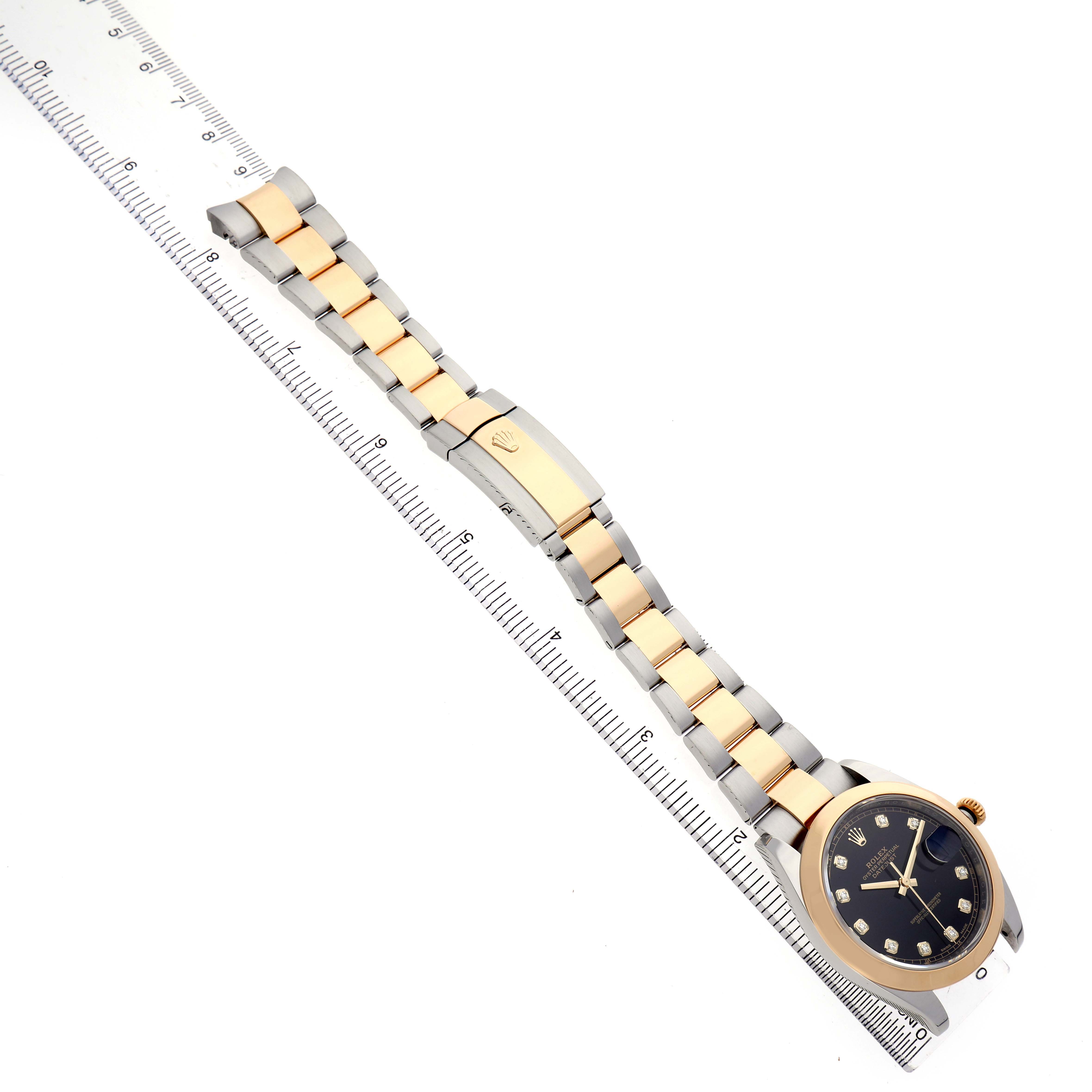 The Rolex Datejust 41 126303 Men's Steel and Gold (two tone) Black Dial is shown diagonally with a full view of the bracelet and the watch face angled to the side.