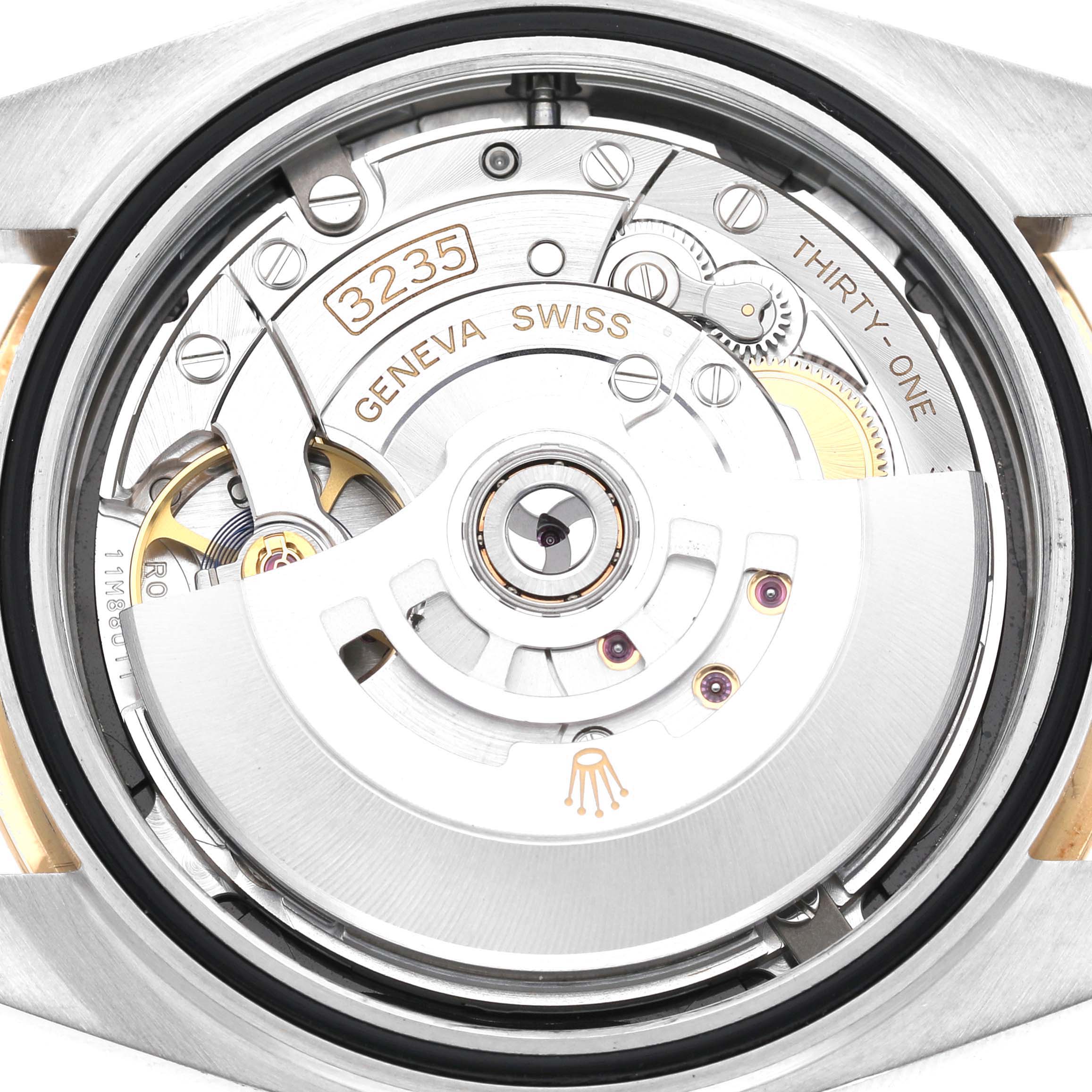 The image shows the movement mechanism of the Rolex Datejust 41 126303 Men's Steel and Gold (two tone) Black Dial, viewed from the back, displaying the rotor and caliber details.