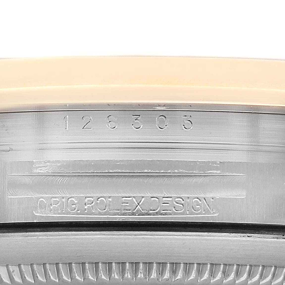 The image shows a close-up of the case side of a Rolex Datejust 41 126303 Men's Steel and Gold (two tone) Black Dial, displaying the serial and model numbers.