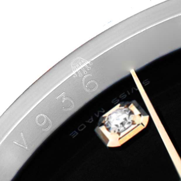 The image shows a close-up of the dial and bezel of a Rolex Datejust 116243 Men's Steel and Gold (two tone) Black Dial, highlighting a diamond hour marker.