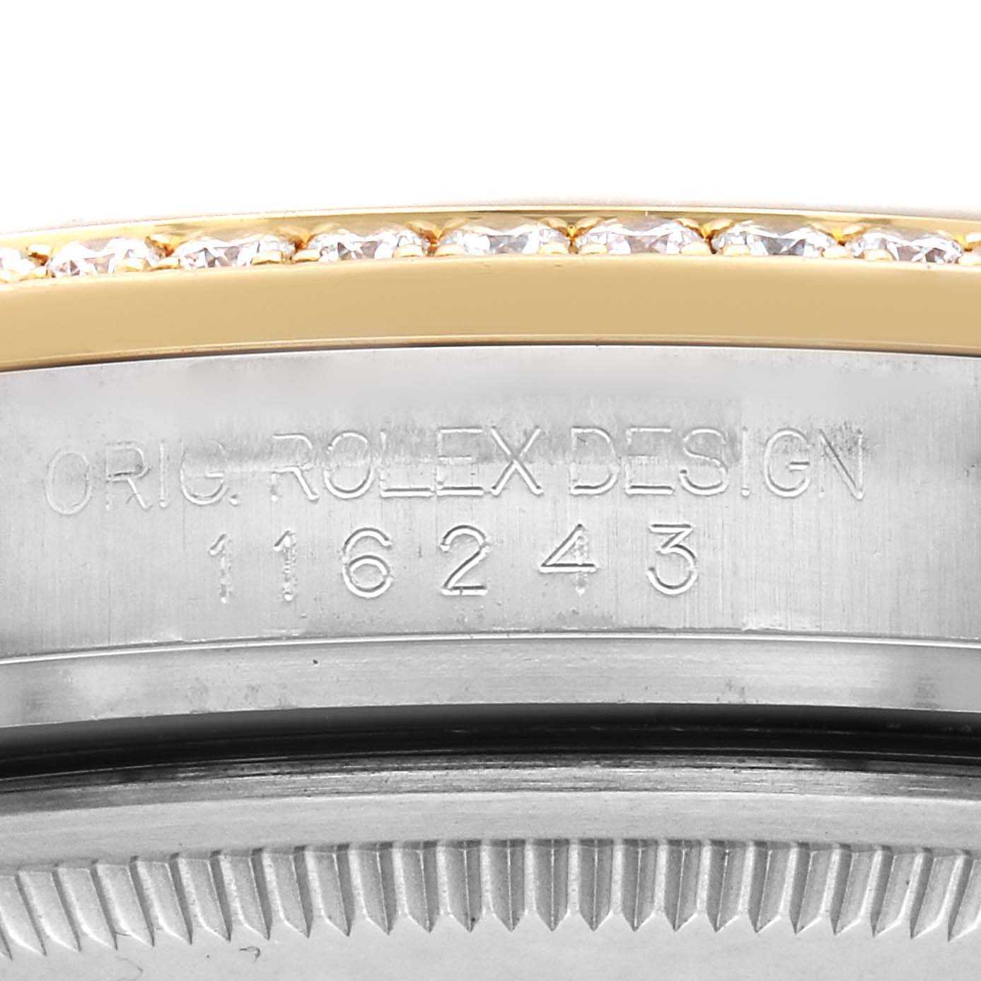 The image shows a close-up view of the bezel and case side of a Rolex Datejust 116243 Men
s Steel and Gold (two tone) Champagne Dial, displaying the model number engraving.