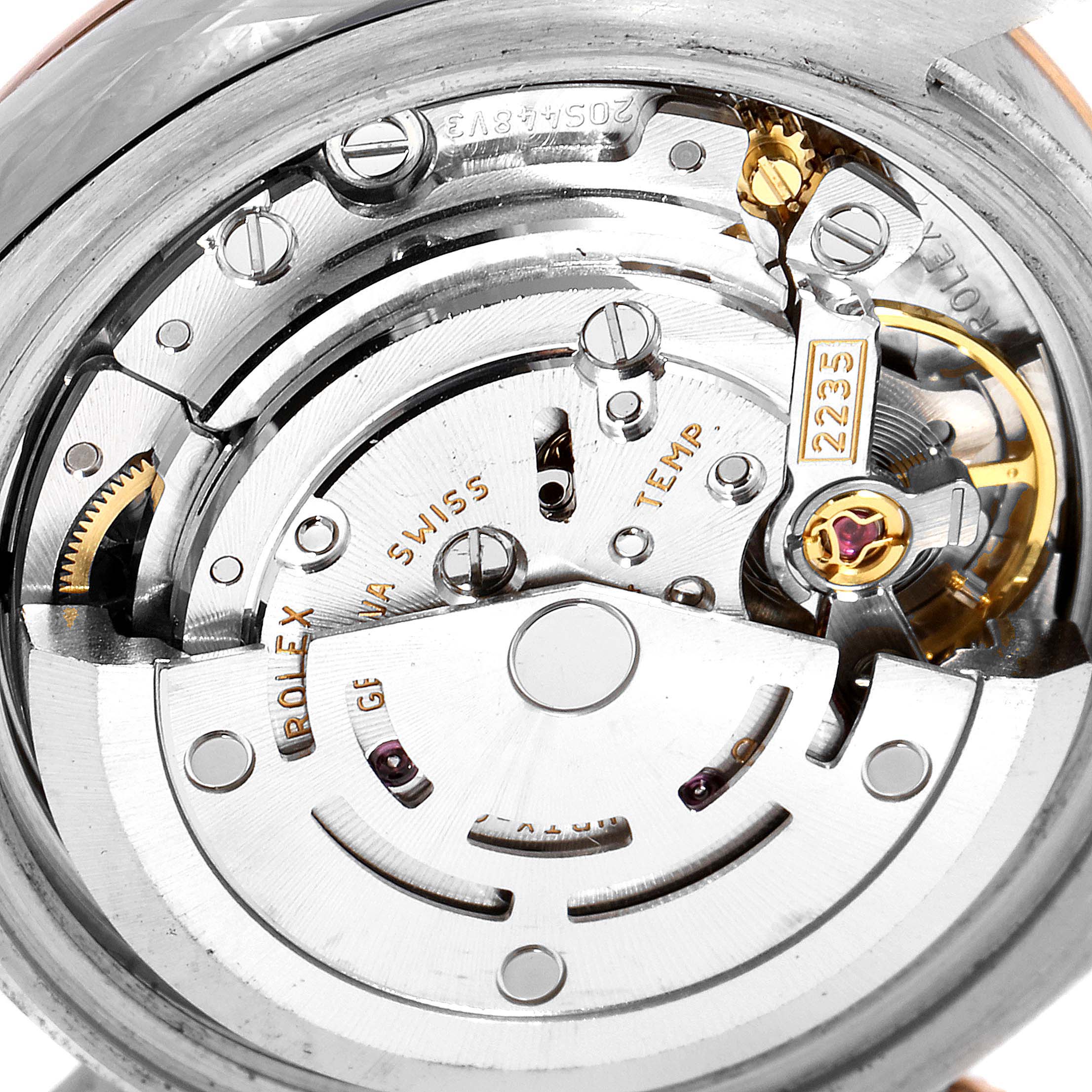 This image shows the intricate movement and internal mechanics of a Rolex Datejust 179171 Women's Rose Gold Black Dial 179171 Women's Rose Gold Black Dial watch from a close-up, angled side view.