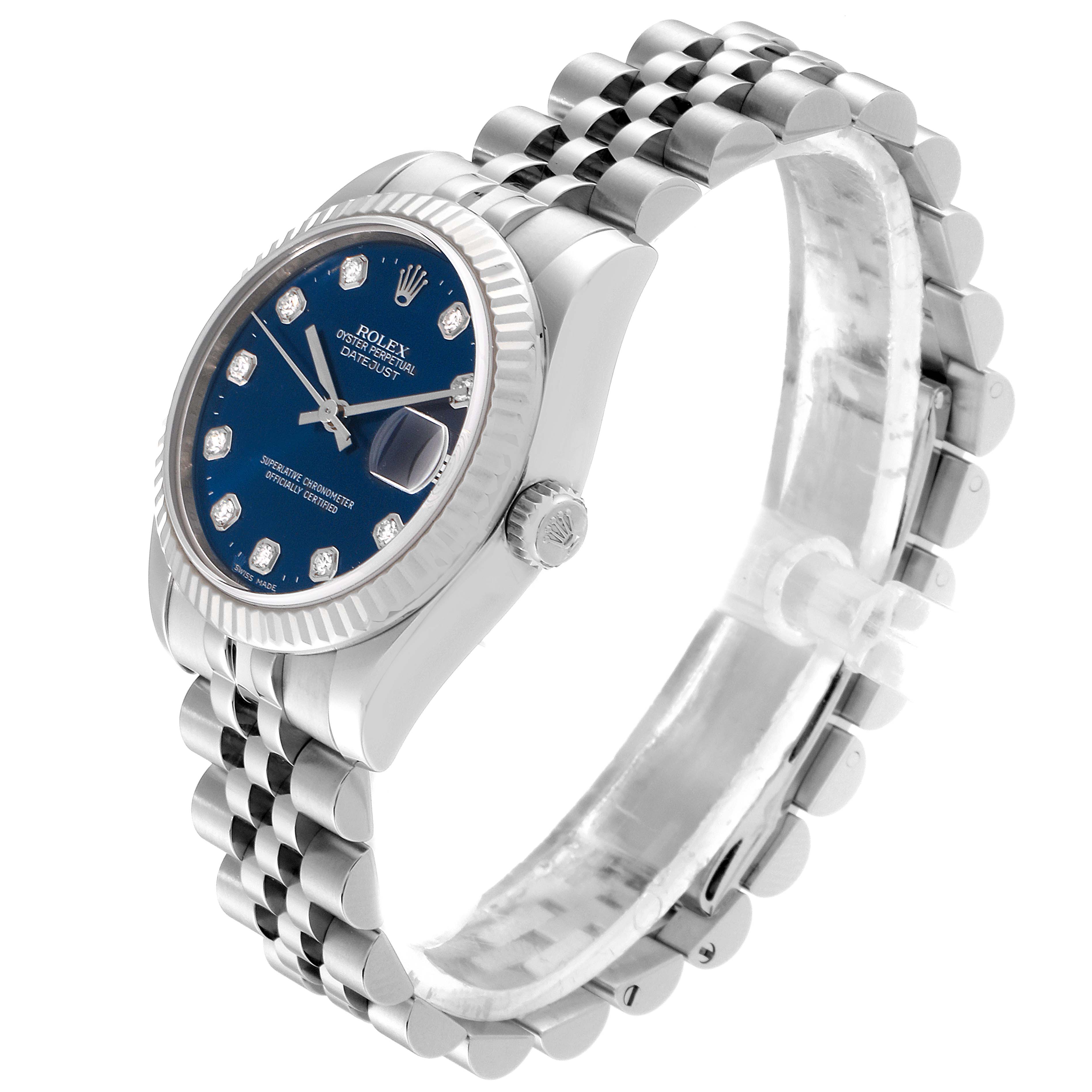 This image shows a side angle of a Rolex Mid-Size 178274 Women
s Stainless Steel Blue Dial 178274 Women
s Stainless Steel Blue Dial watch, highlighting its blue dial, fluted bezel, jubilee bracelet, and crown.