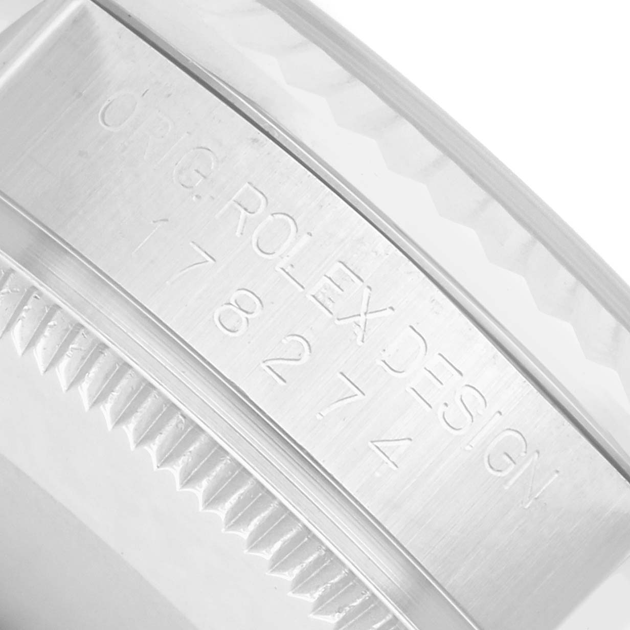 The image shows a close-up of the side of a Rolex Datejust 178274 Women's Stainless Steel White Dial, highlighting the original design engraving and part of the bezel.